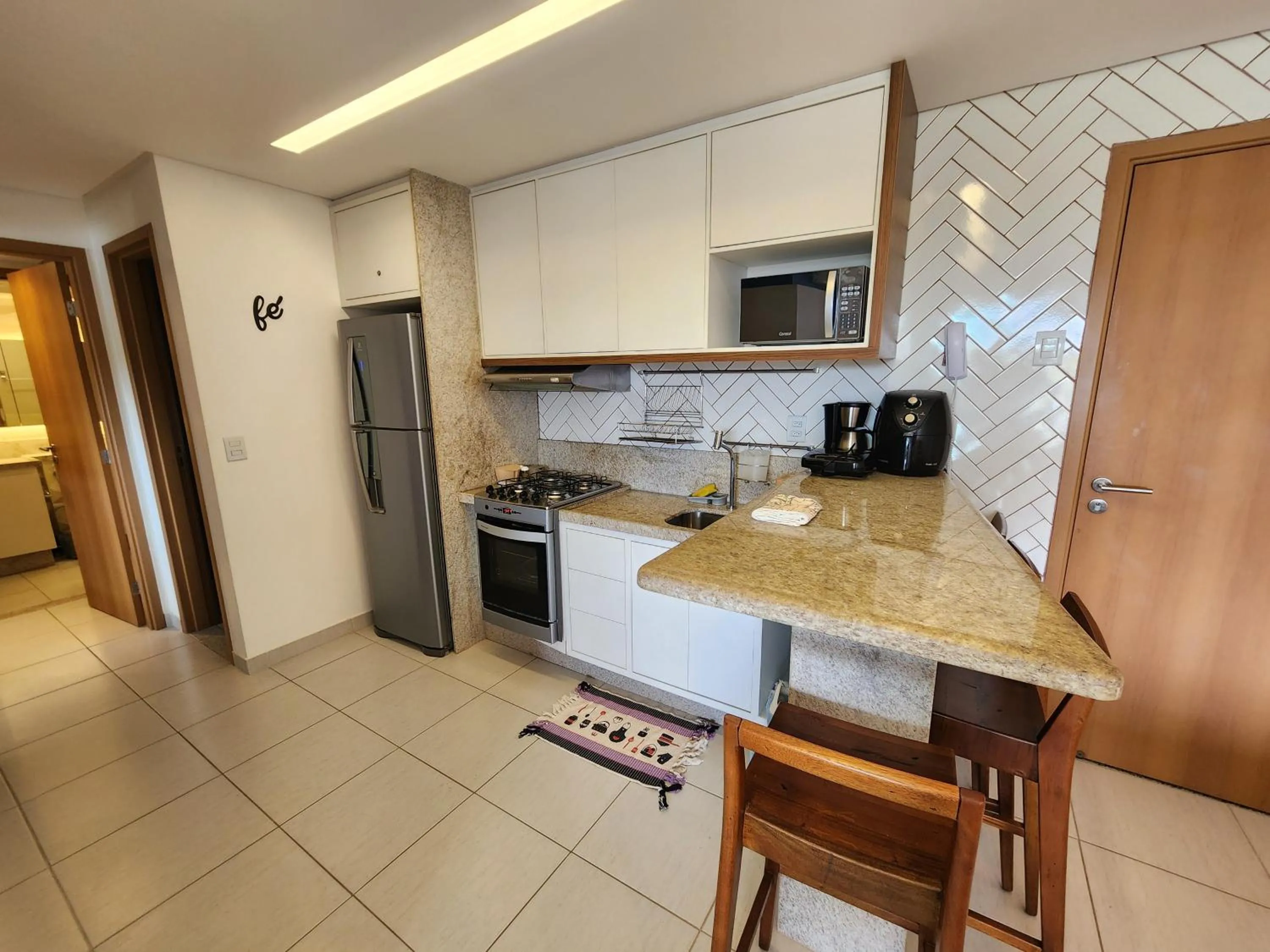 Kitchen or kitchenette in Cupe Beach Living Beira Mar