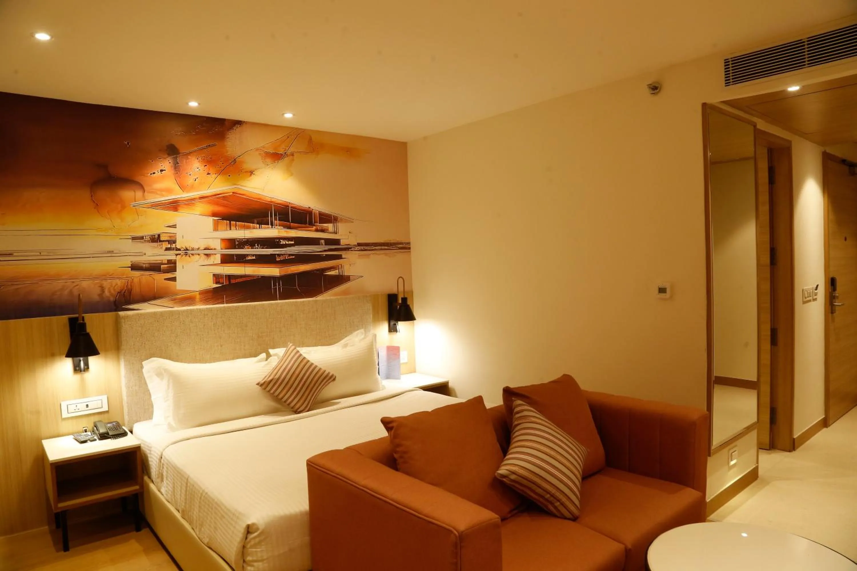 Seating area, Bed in Tulip Inn Zirakpur