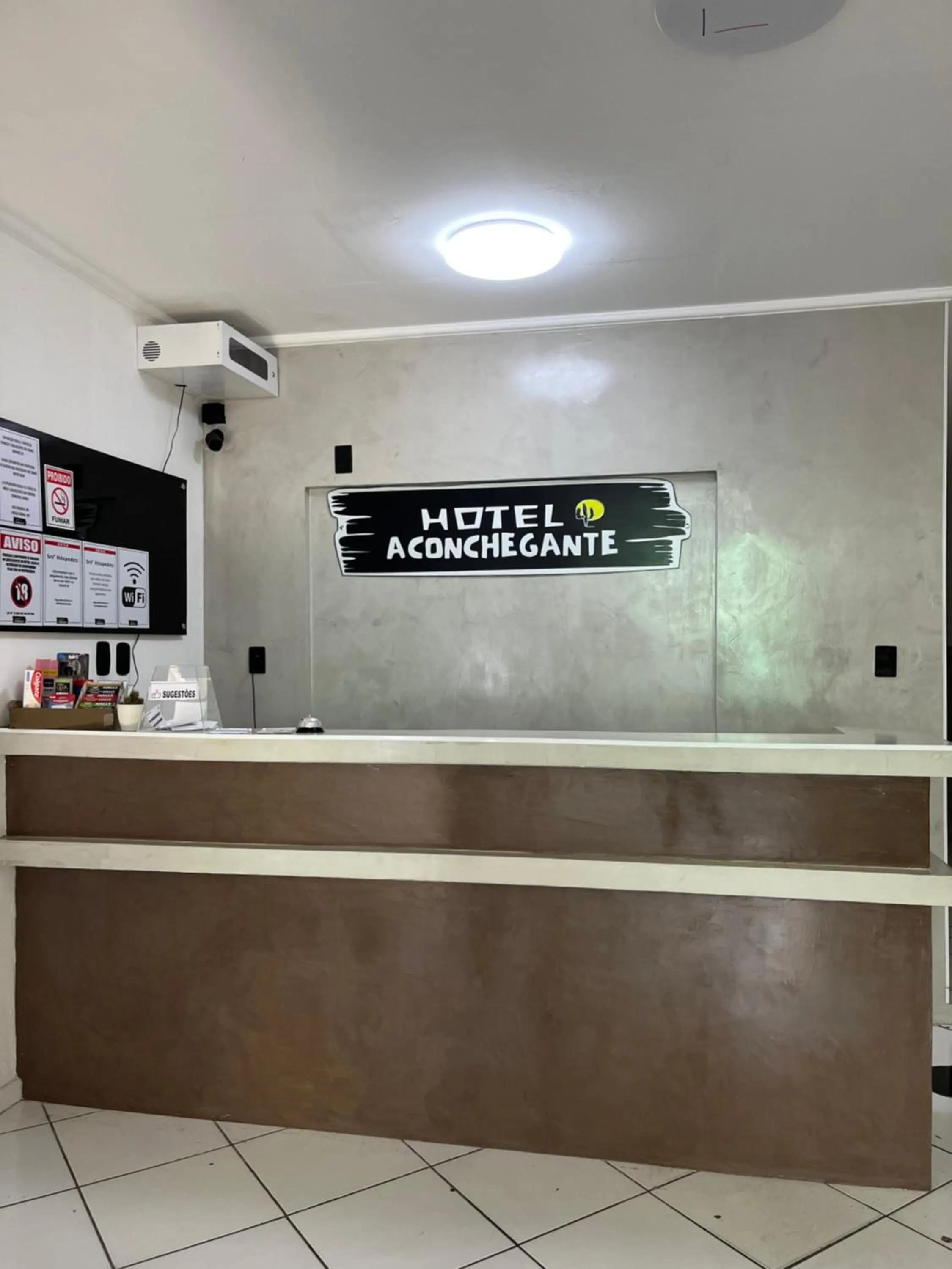 Property logo or sign in Hotel Aconchegante
