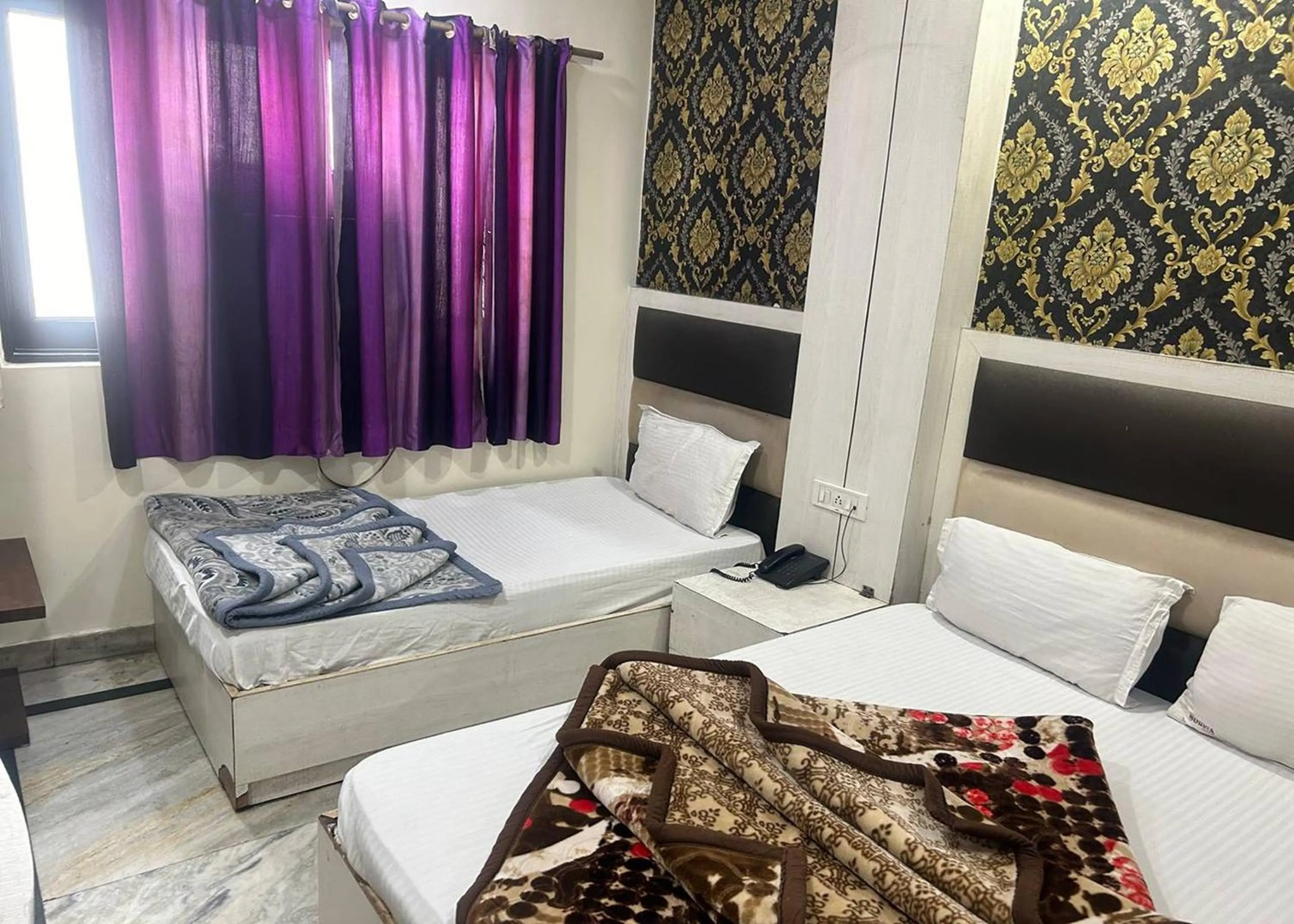 Bed in Hotel Mourya Deluxe