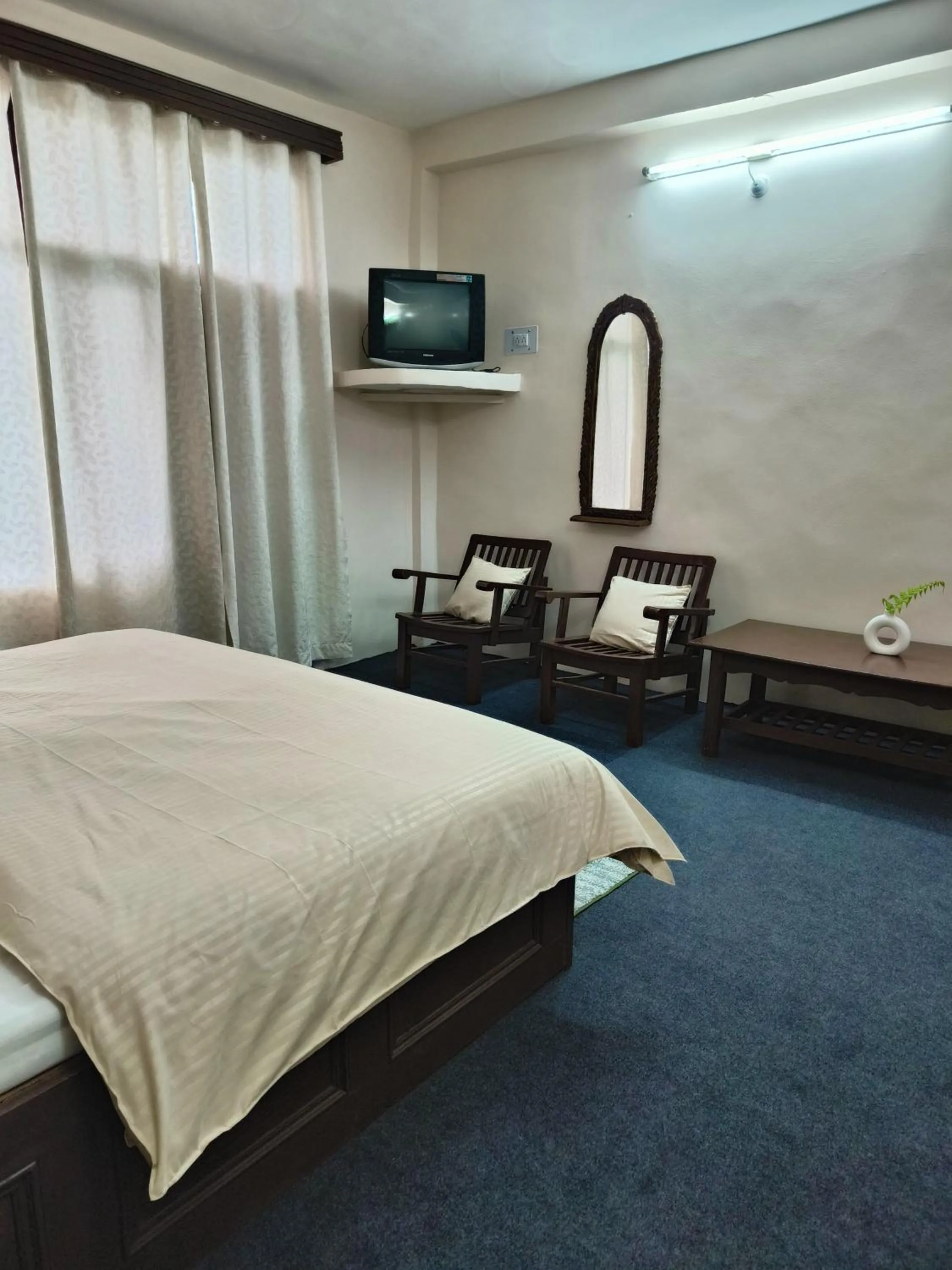 Seating area, Bed in The Kailasha Homestay