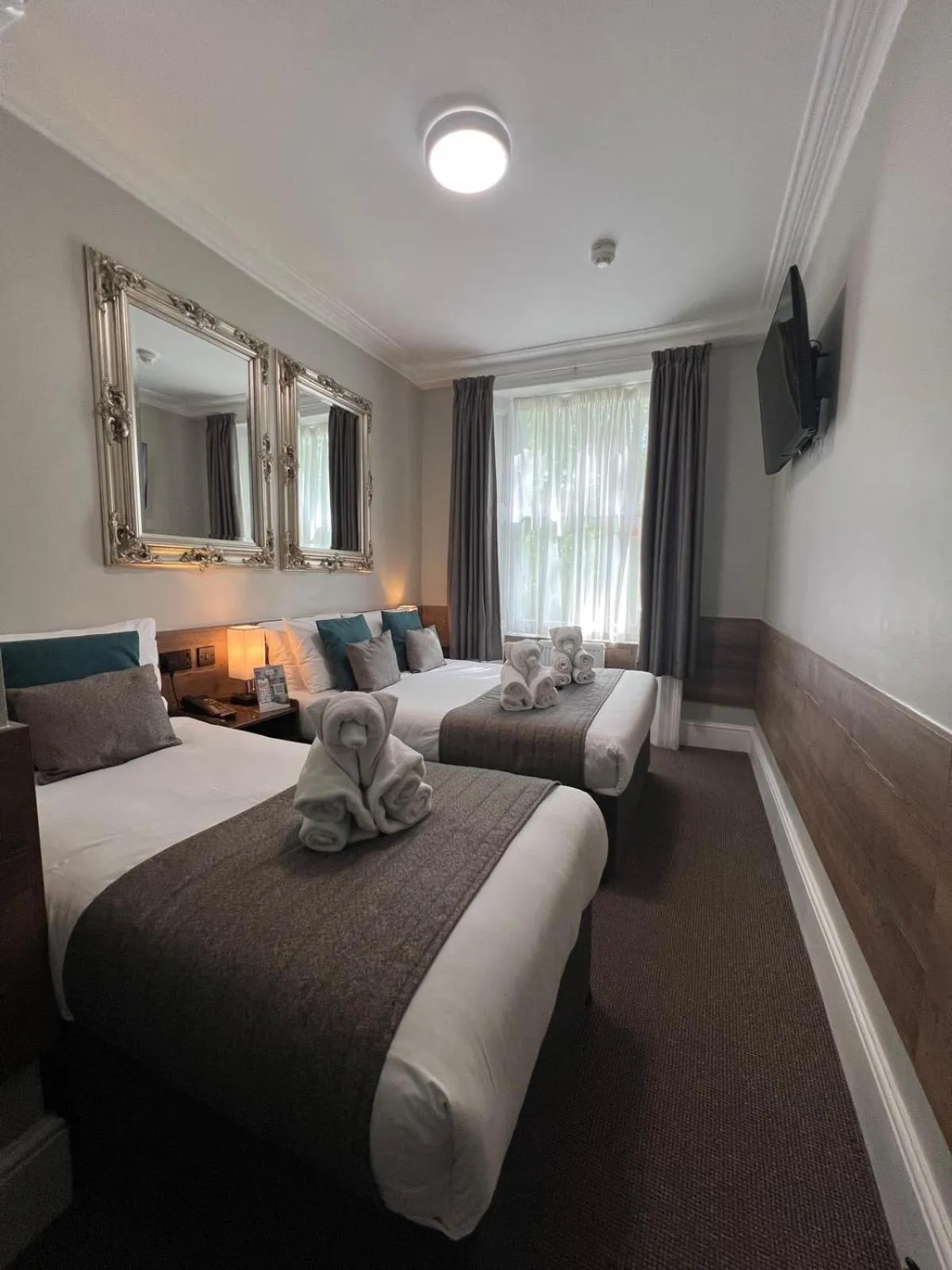 Bed in Tudor Court Hotel