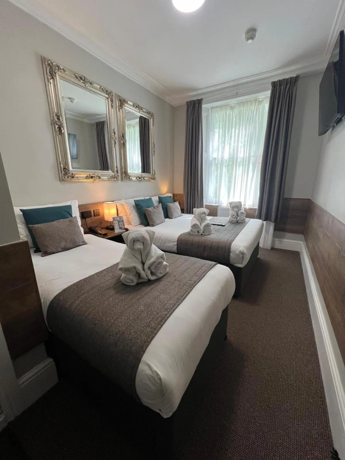 Bed in Tudor Court Hotel