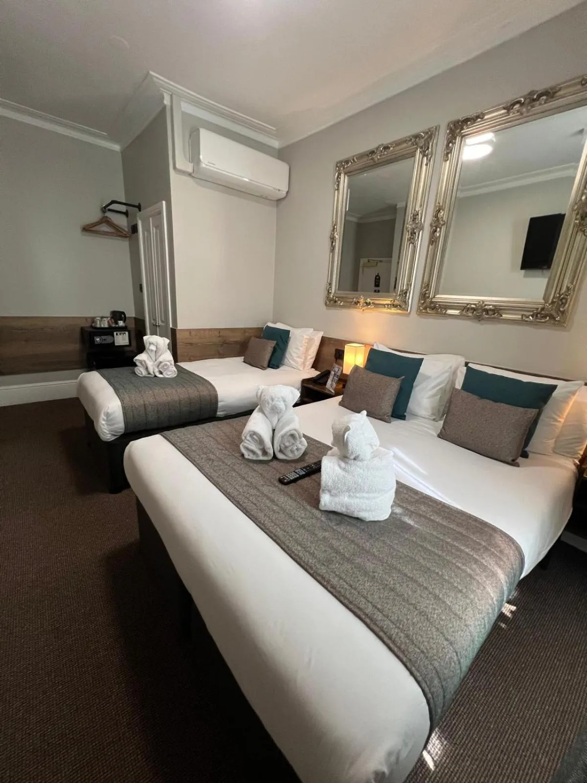 Bed in Tudor Court Hotel