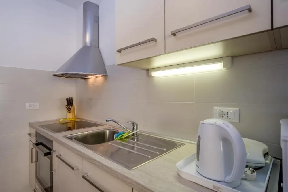 Kitchen or kitchenette in Apartments Josipa