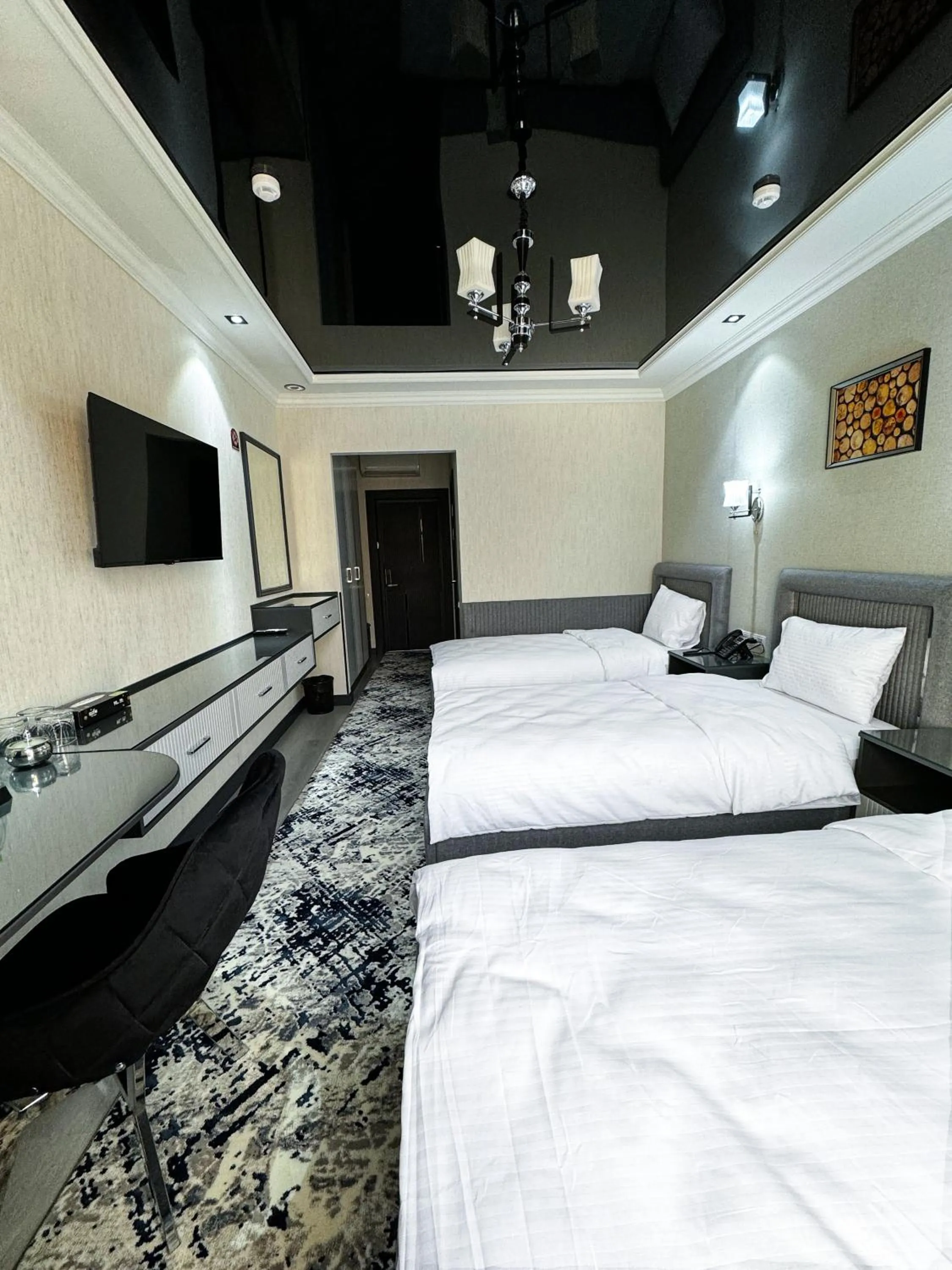 Bed in De Villa Hotel