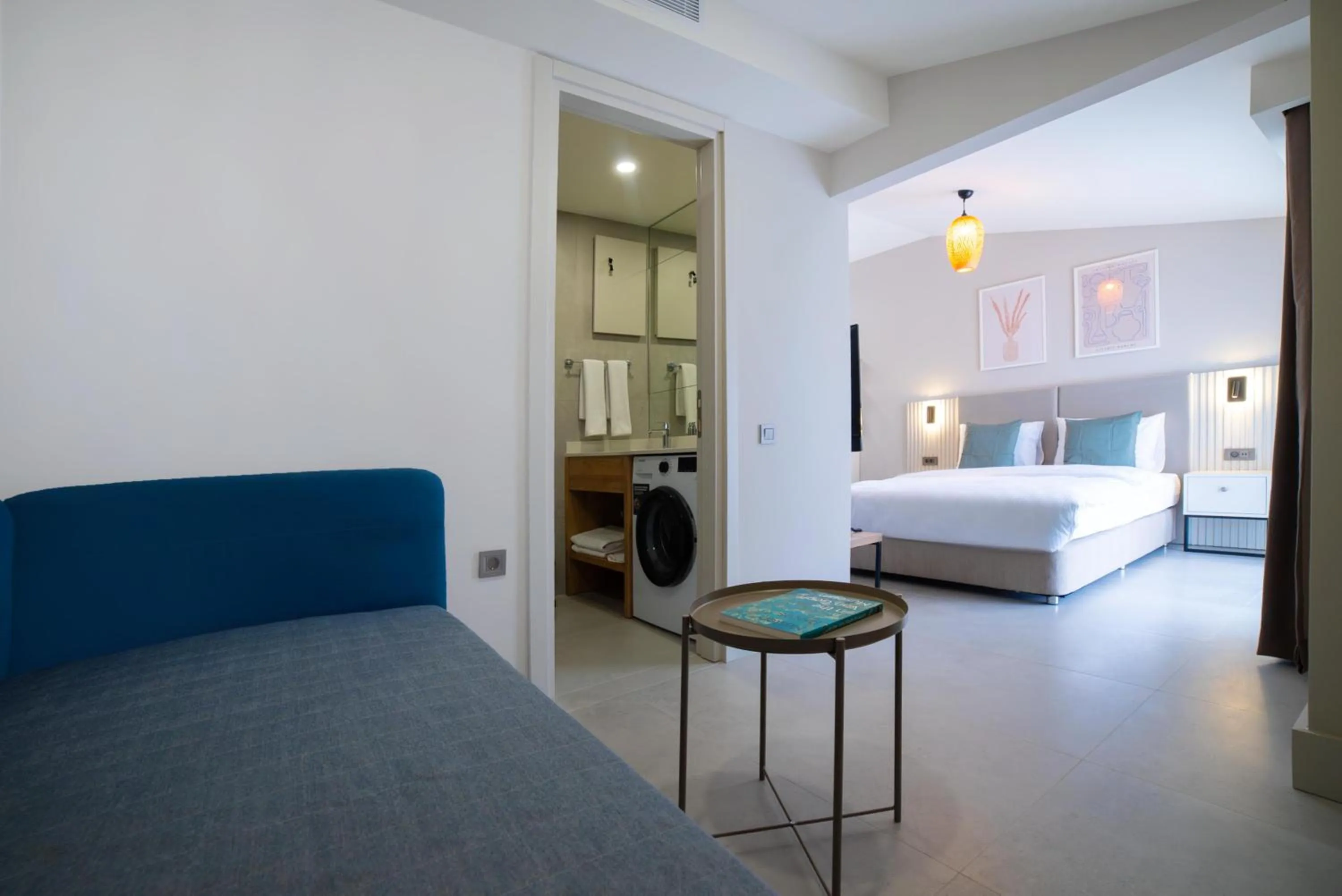 Seating area, Bed in Bomo Suites