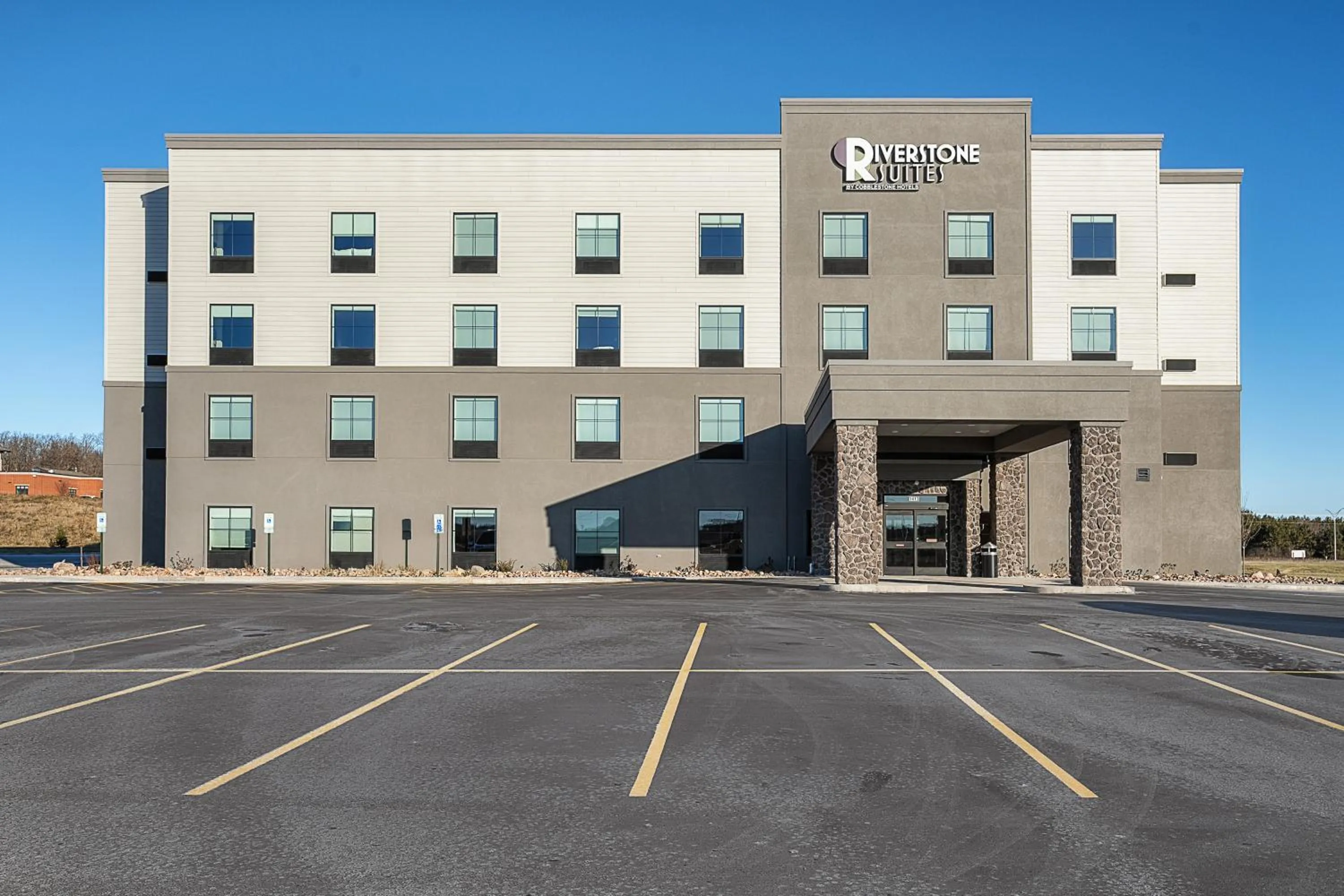 Property building in Riverstone Suites by Cobblestone Hotels - Chippewa Falls