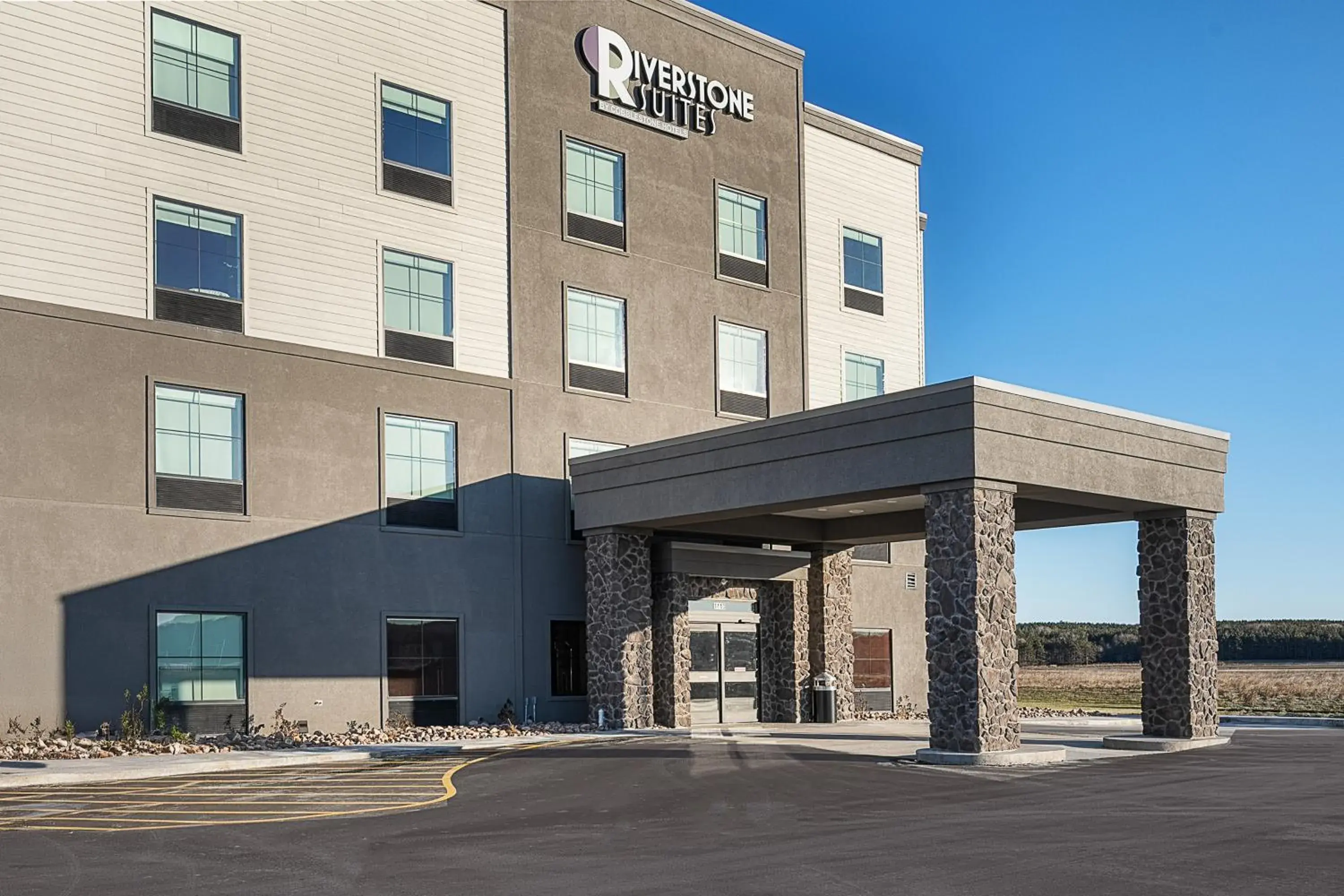 Property building in Riverstone Suites by Cobblestone Hotels - Chippewa Falls Property building in Riverstone Suites by Cobblestone Hotels - Chippewa Falls