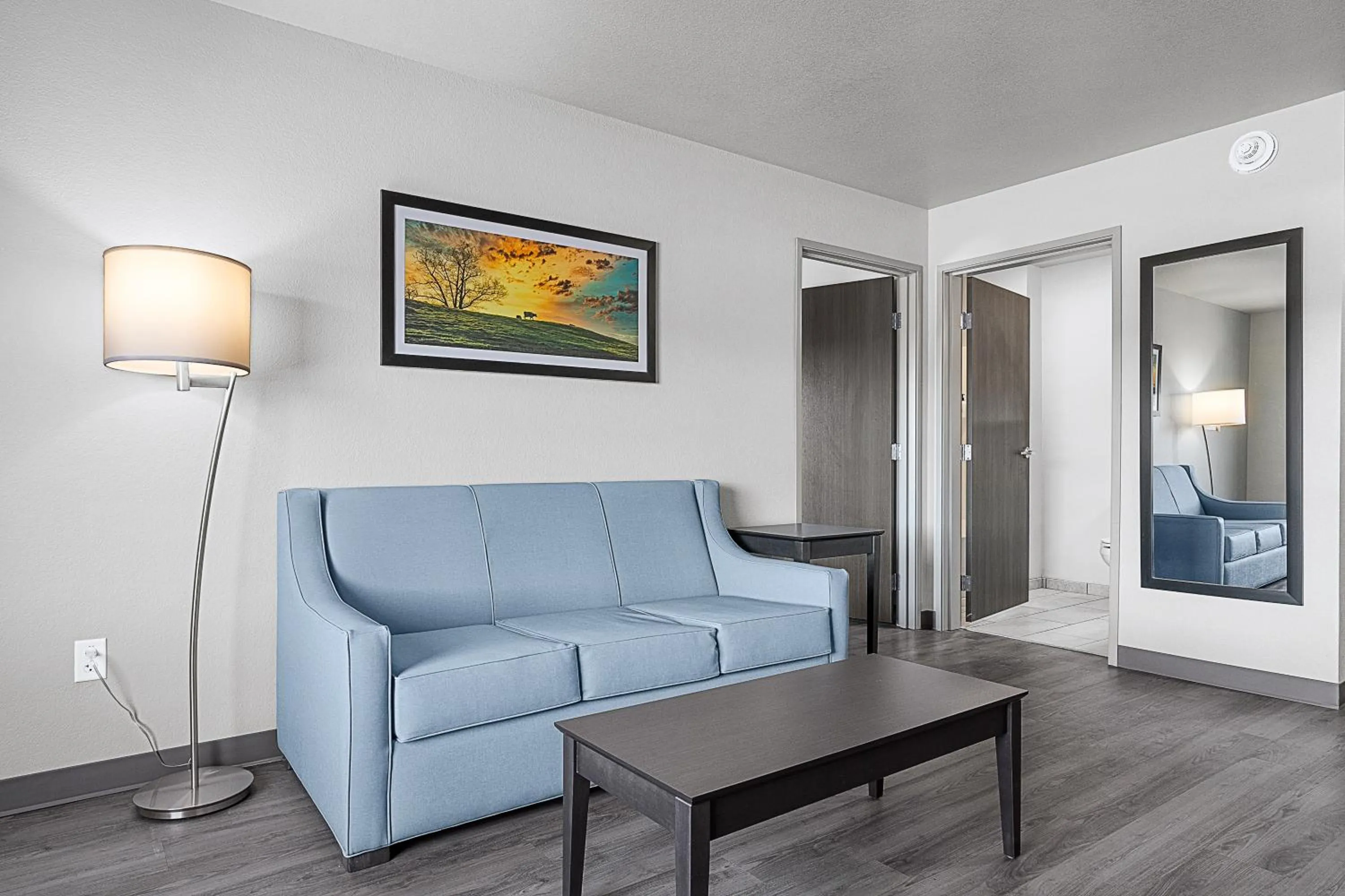 Seating area in Riverstone Suites by Cobblestone Hotels - Chippewa Falls