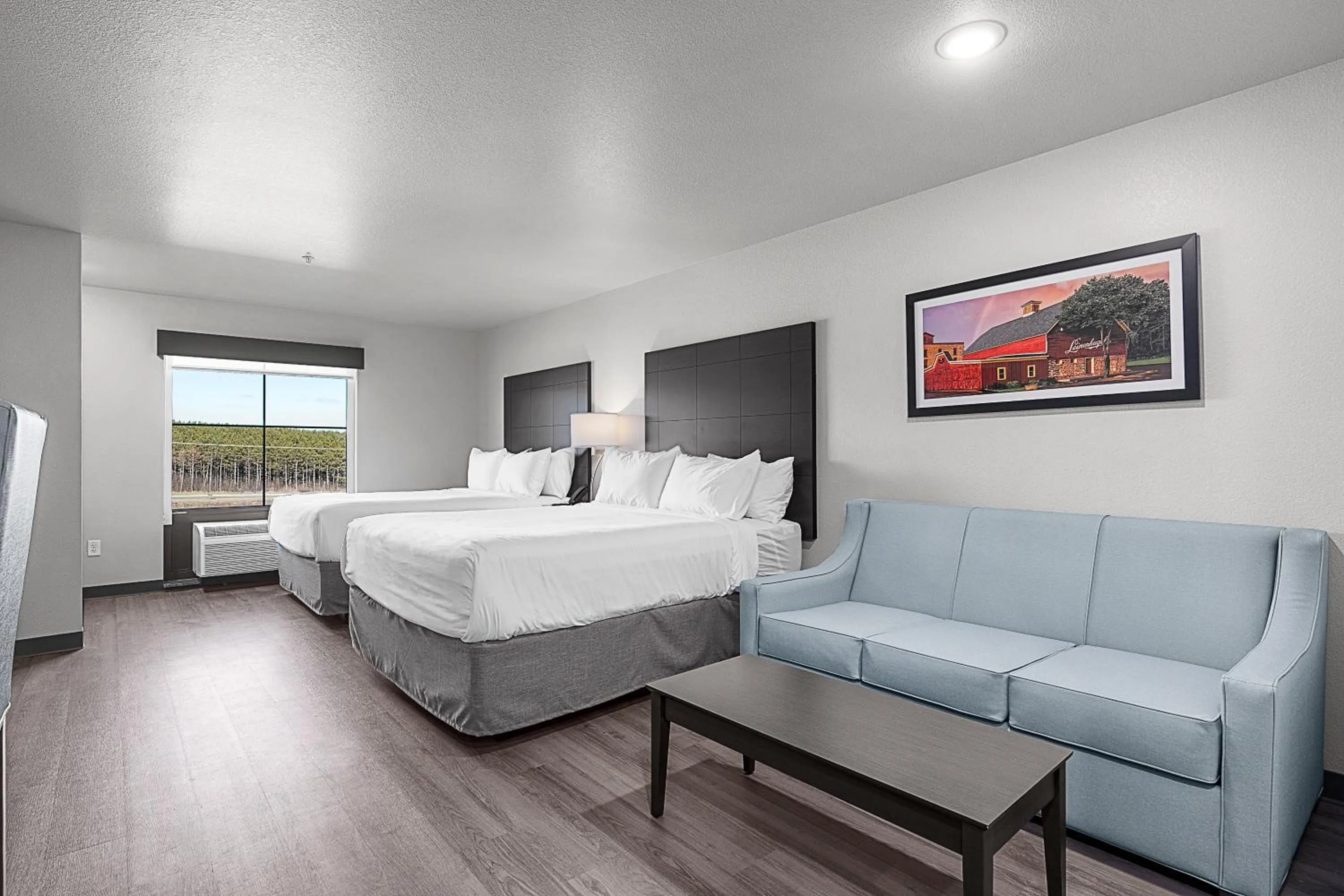 Bedroom, Bed in Riverstone Suites by Cobblestone Hotels - Chippewa Falls