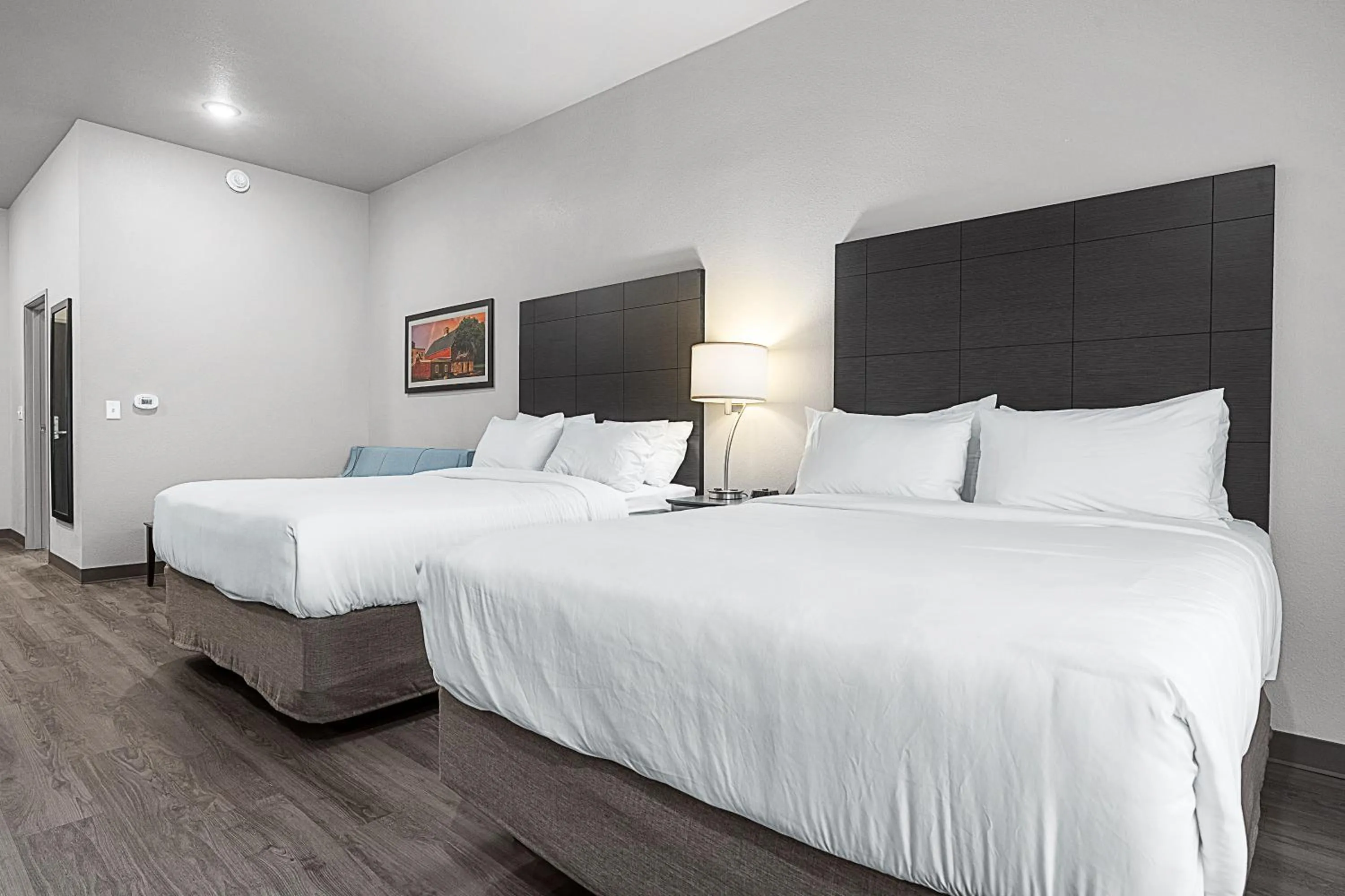 Bed in Riverstone Suites by Cobblestone Hotels - Chippewa Falls