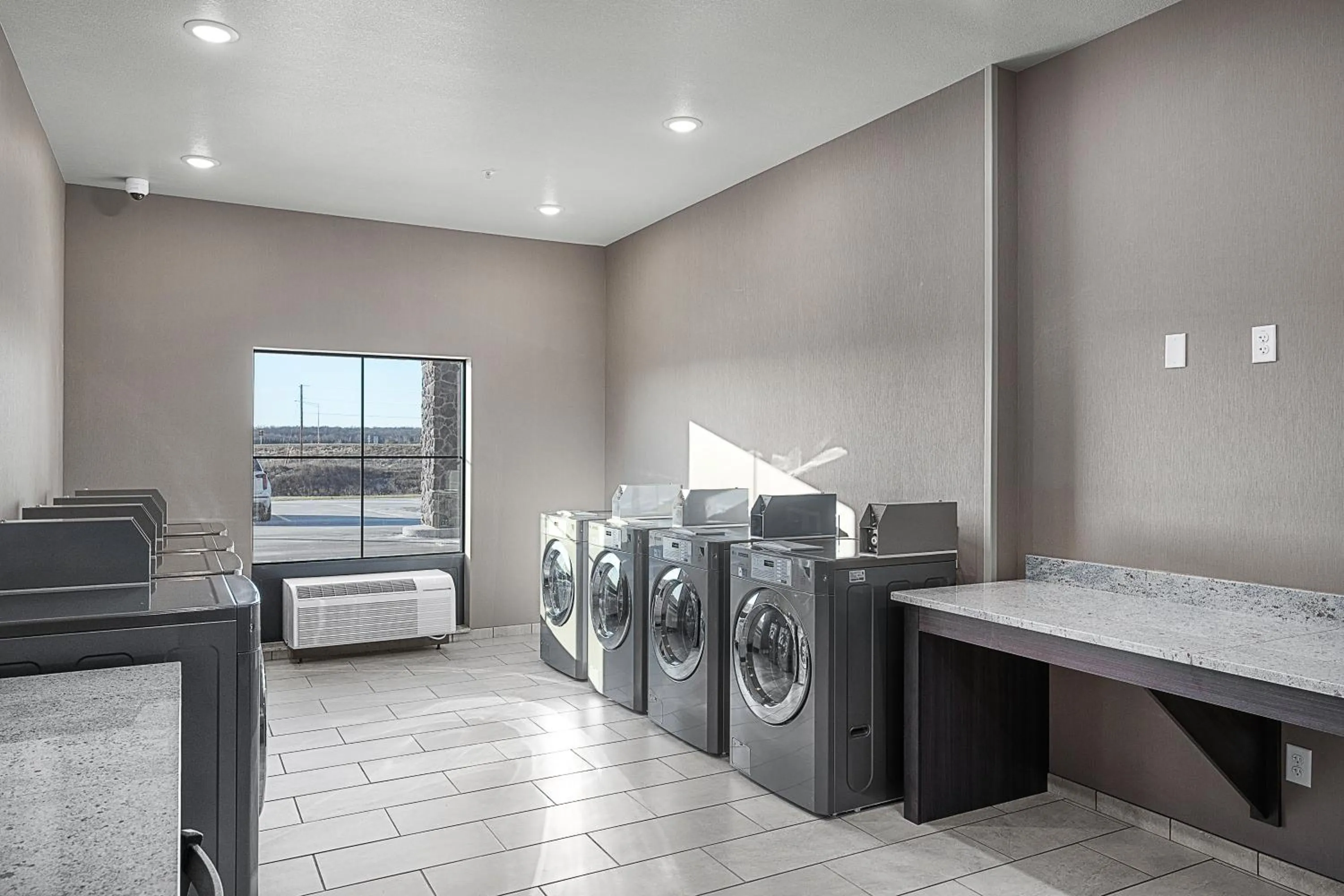 laundry in Riverstone Suites by Cobblestone Hotels - Chippewa Falls