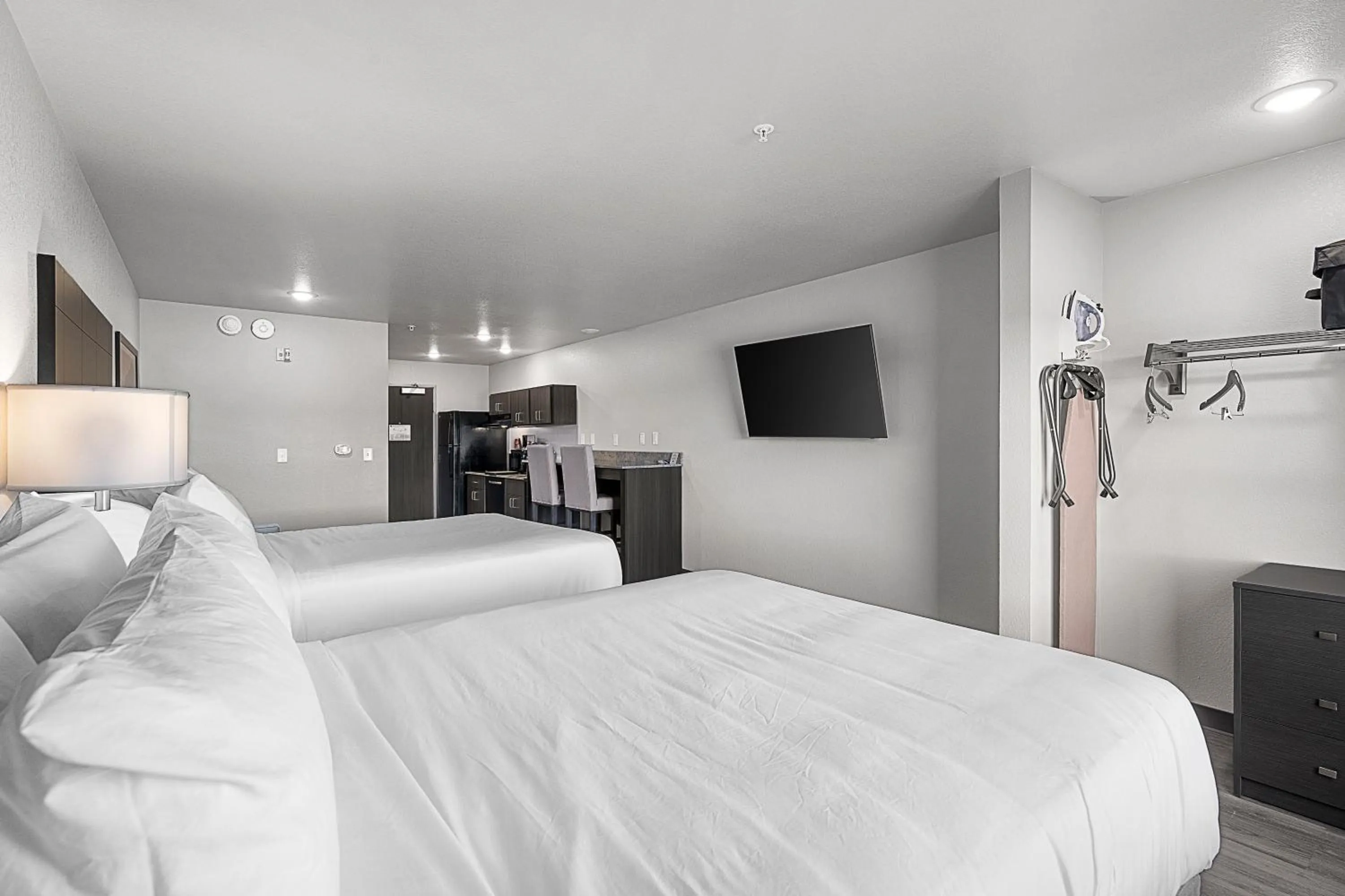 Bedroom, Bed in Riverstone Suites by Cobblestone Hotels - Chippewa Falls