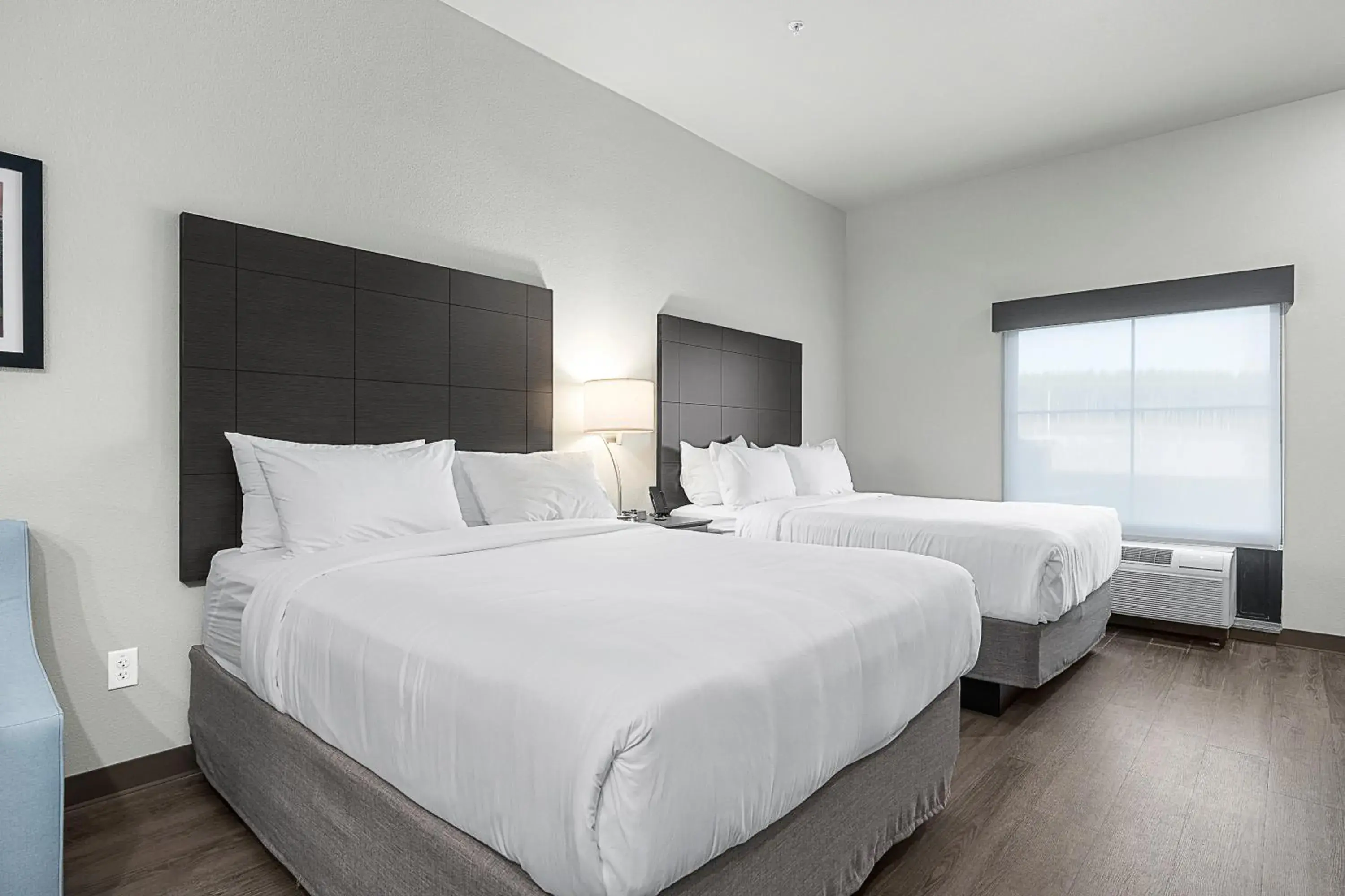 Bedroom, Bed in Riverstone Suites by Cobblestone Hotels - Chippewa Falls Bedroom, Bed in Riverstone Suites by Cobblestone Hotels - Chippewa Falls