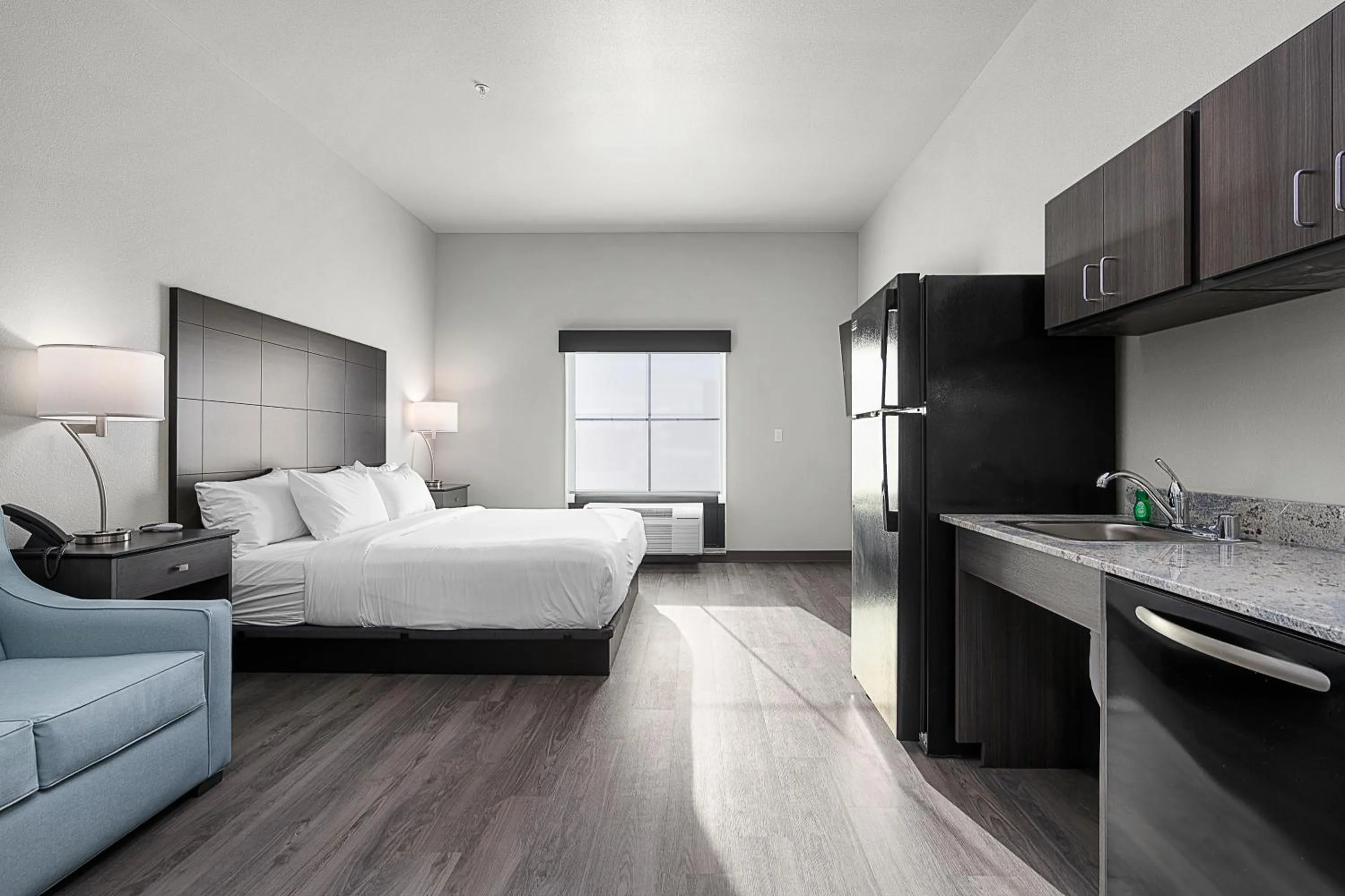 Bedroom, Bed in Riverstone Suites by Cobblestone Hotels - Chippewa Falls