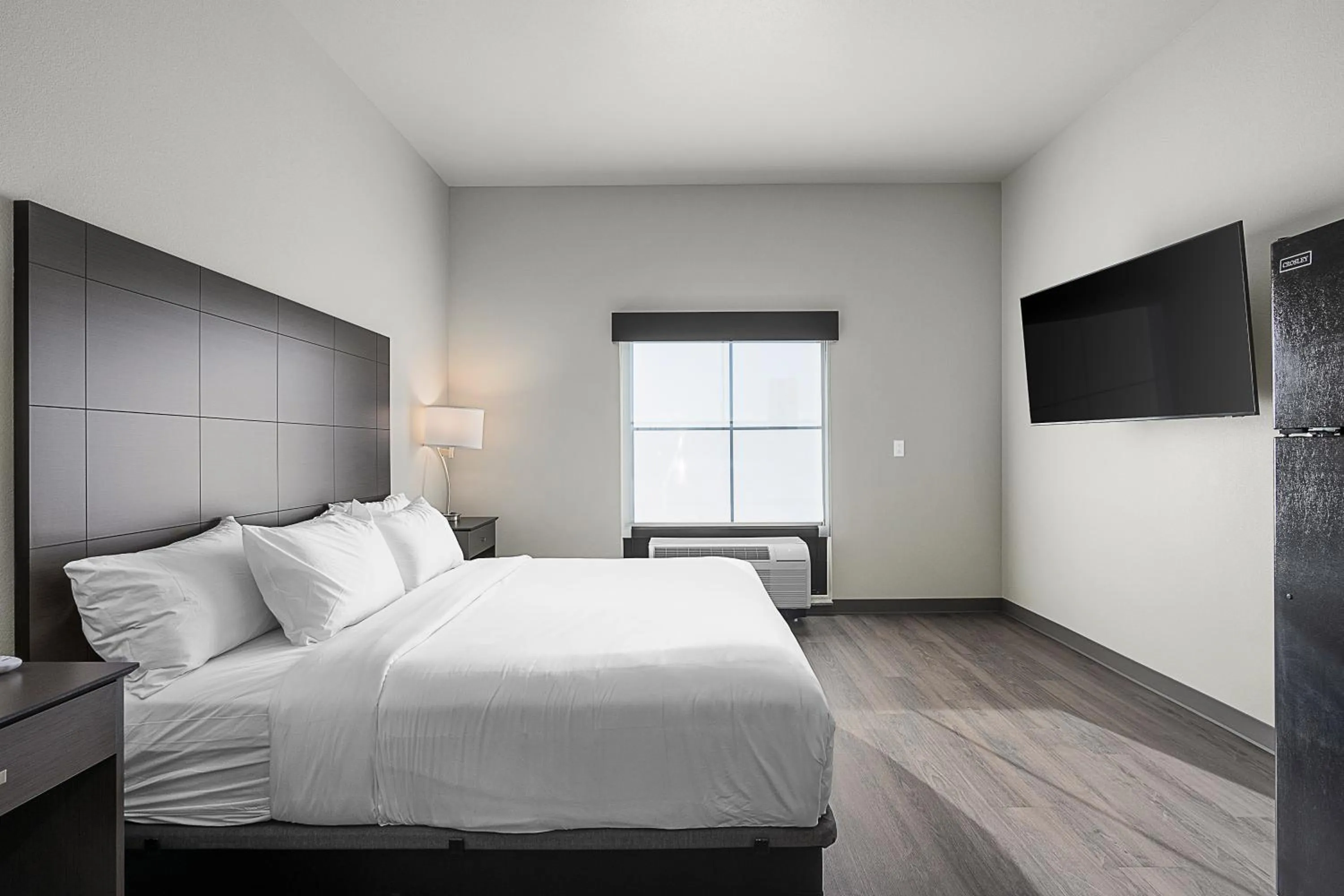 Bedroom, Bed in Riverstone Suites by Cobblestone Hotels - Chippewa Falls