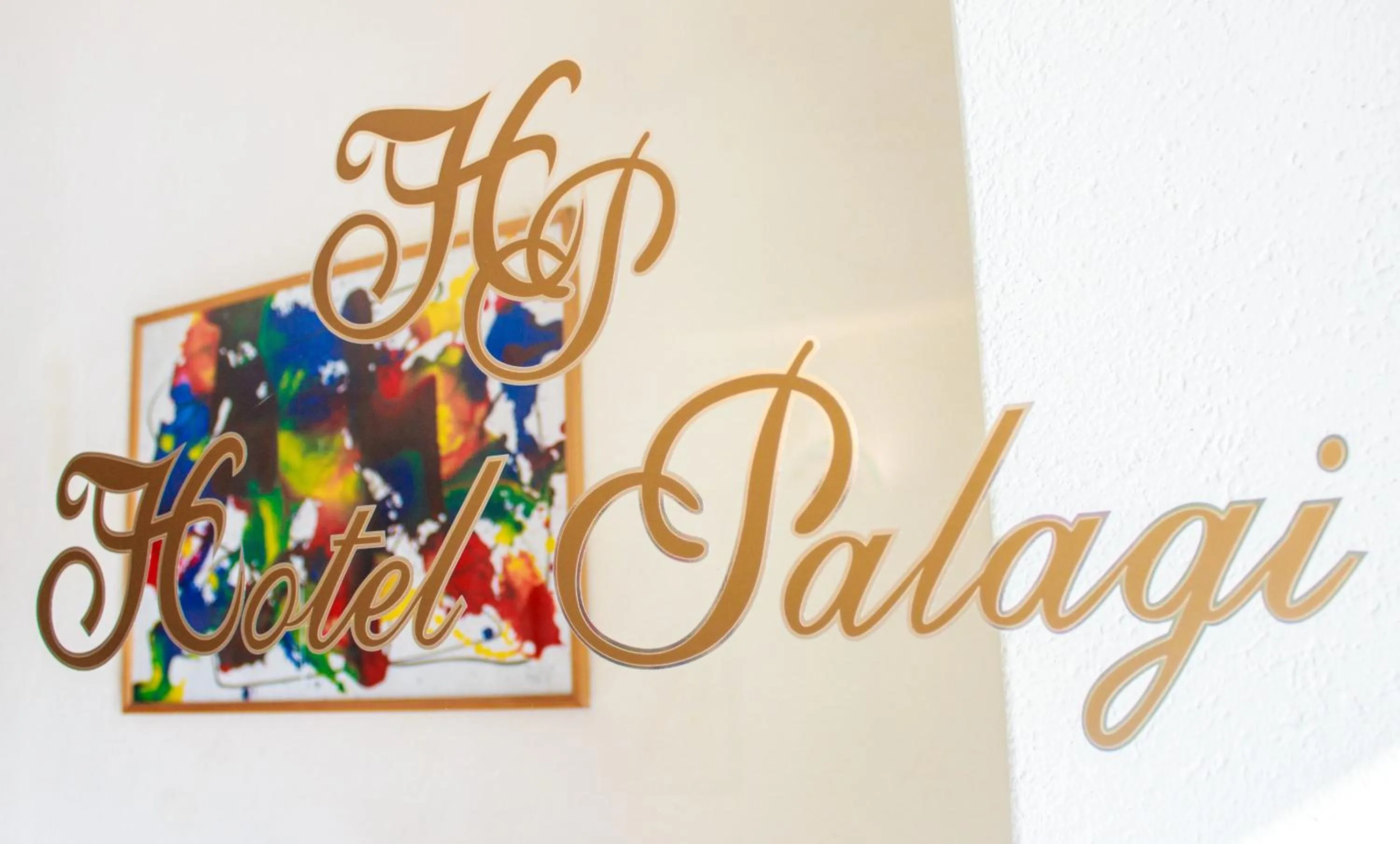 Property logo or sign in Hotel Palagi