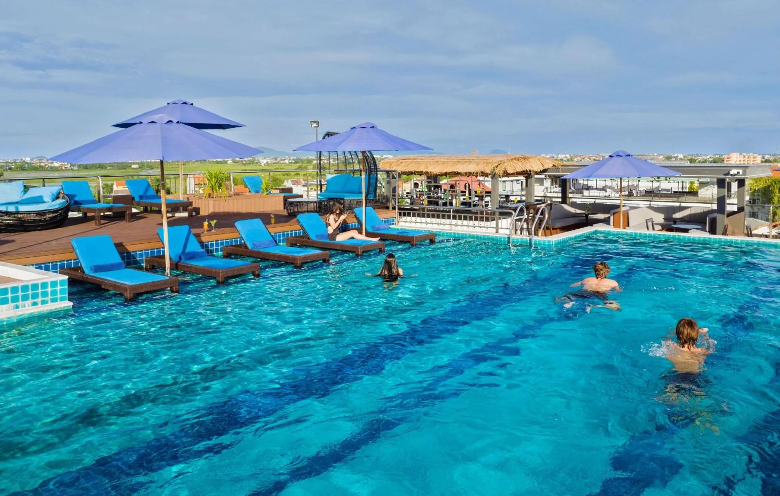 People in Qualia De Hôtel Hoi An - Rooftop Bar City View