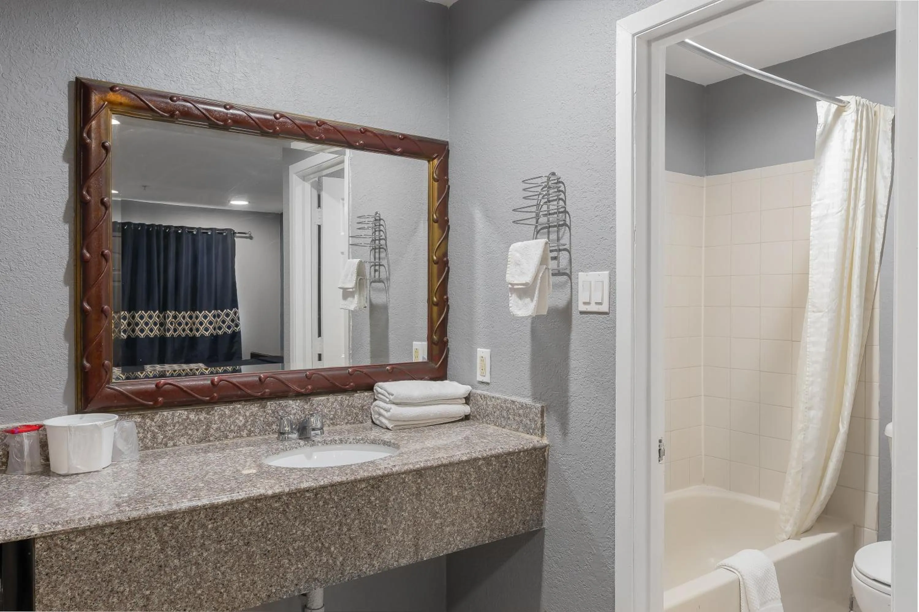 Shower in Golden Inn Dallas by Hotel O