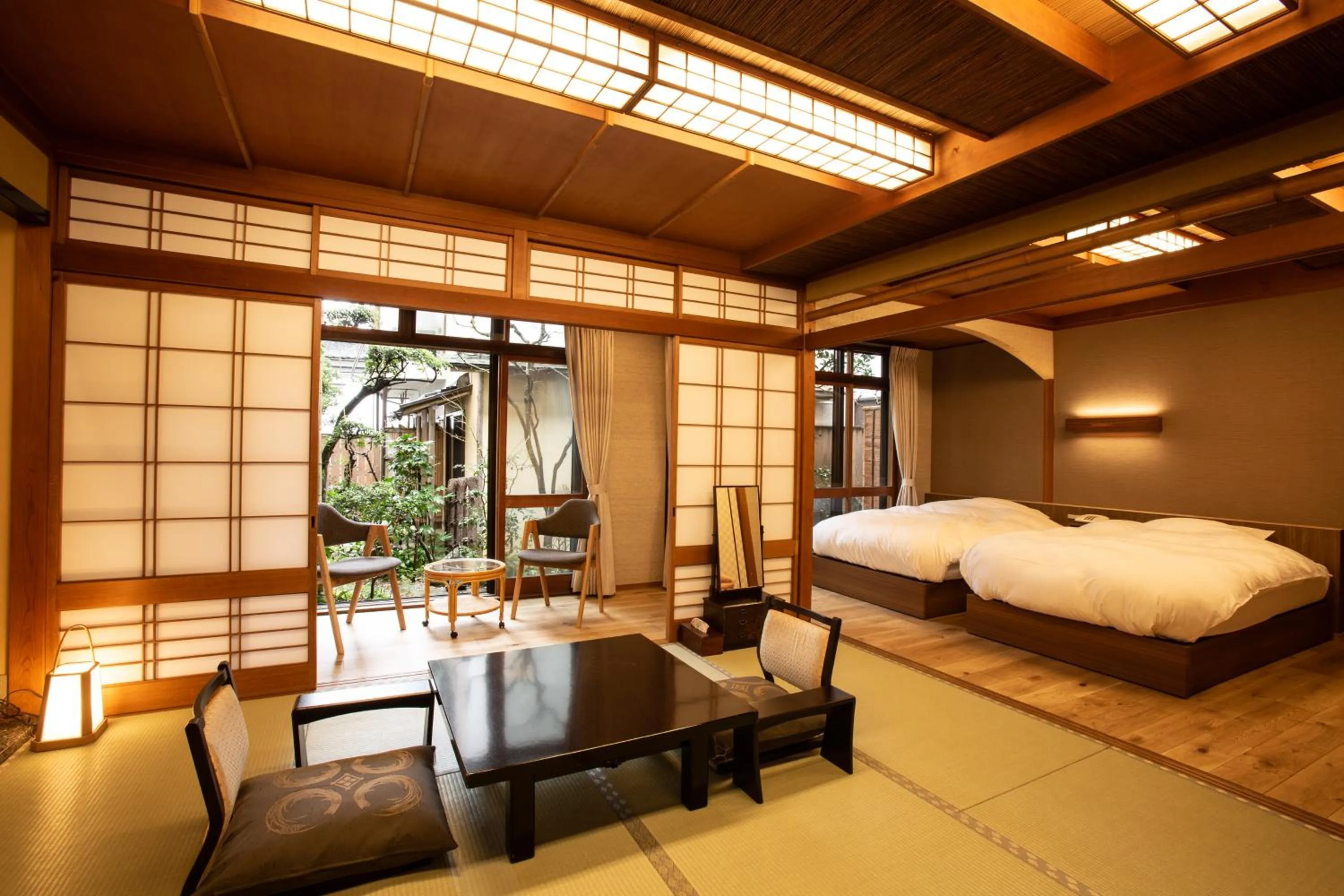 Bed in 城崎温泉 旅館 つばき乃 - Kinosaki Onsen Ryokan Tsubakino