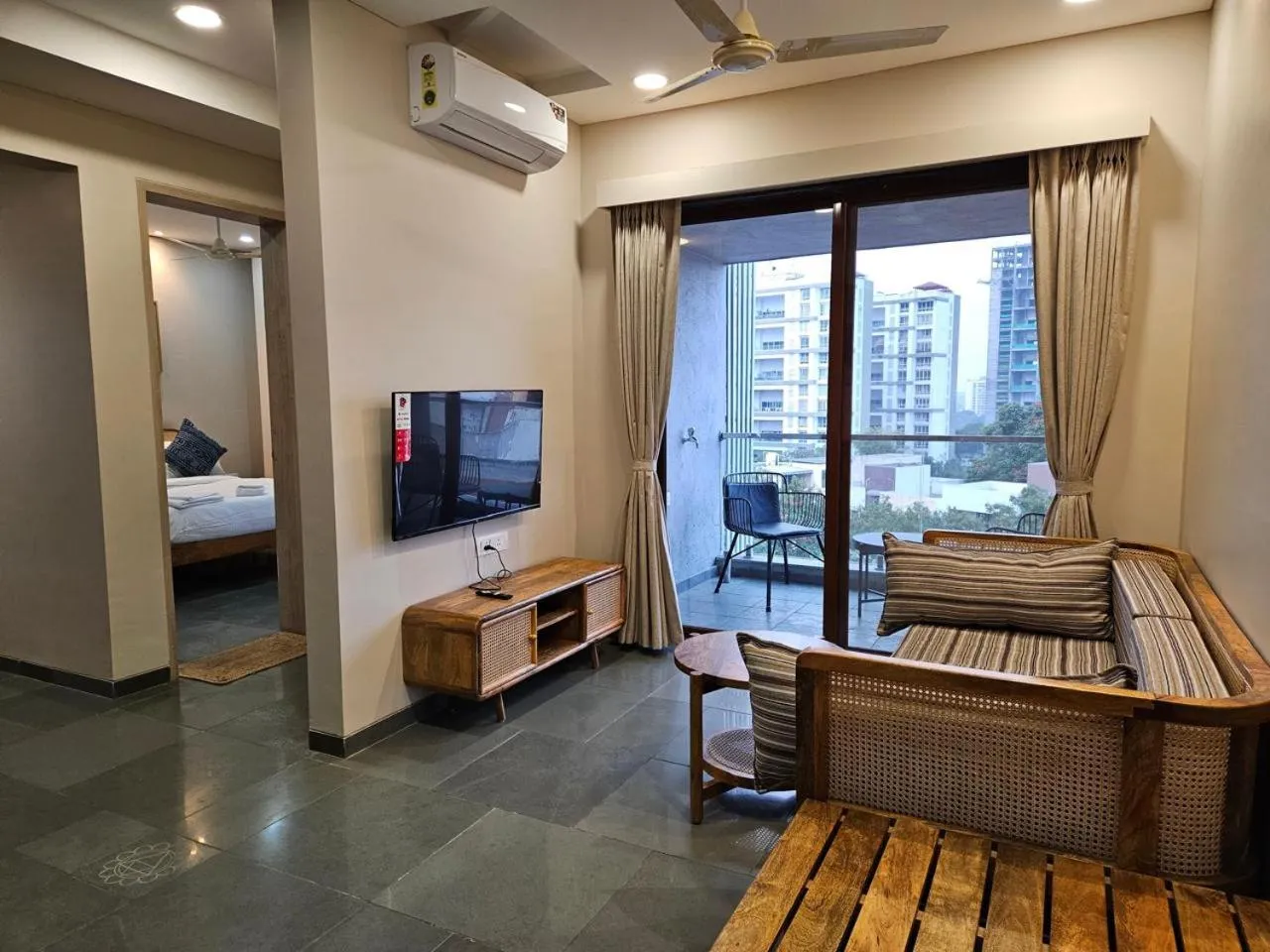 Communal lounge/ TV room, Bed in Hotel Tattva Suites
