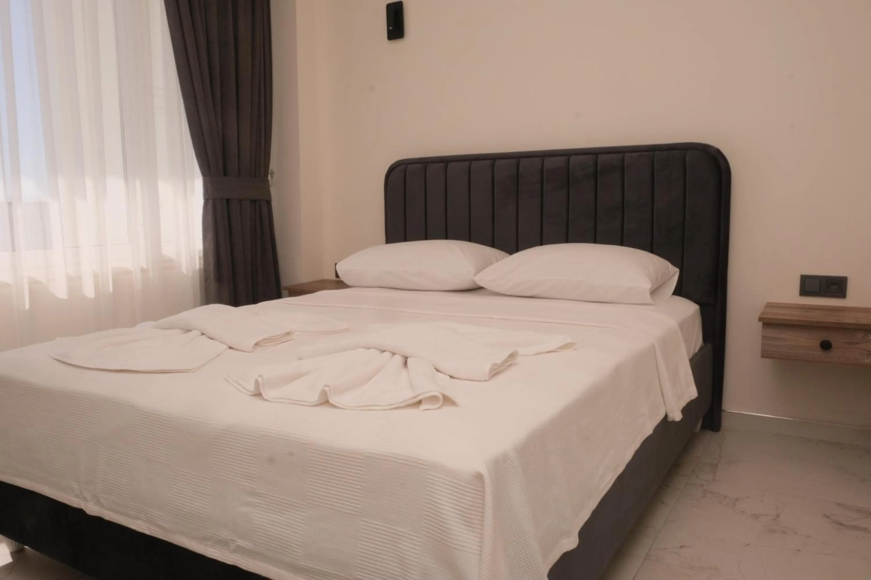 Bed in Sea Door Hotel