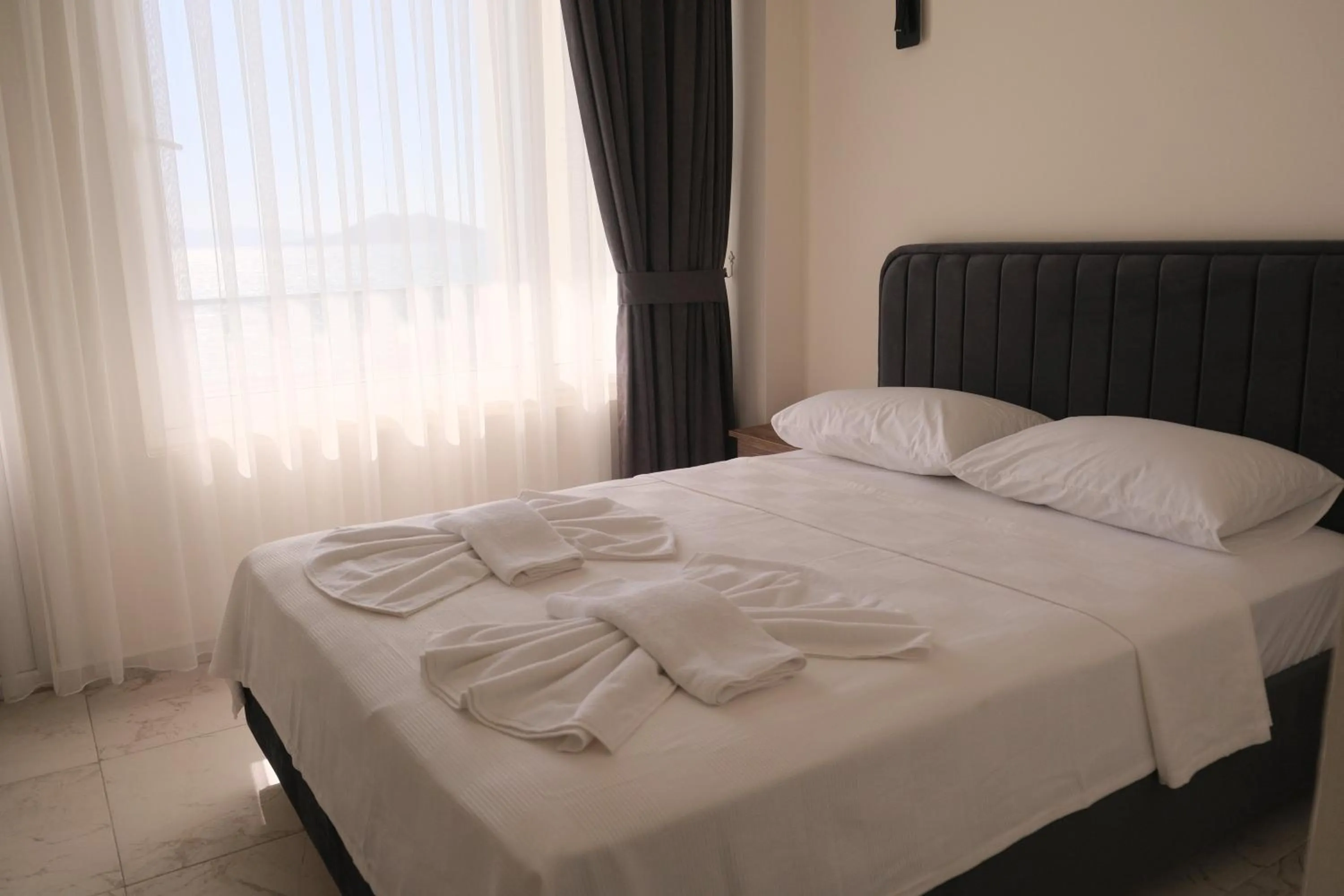 Bed in Sea Door Hotel