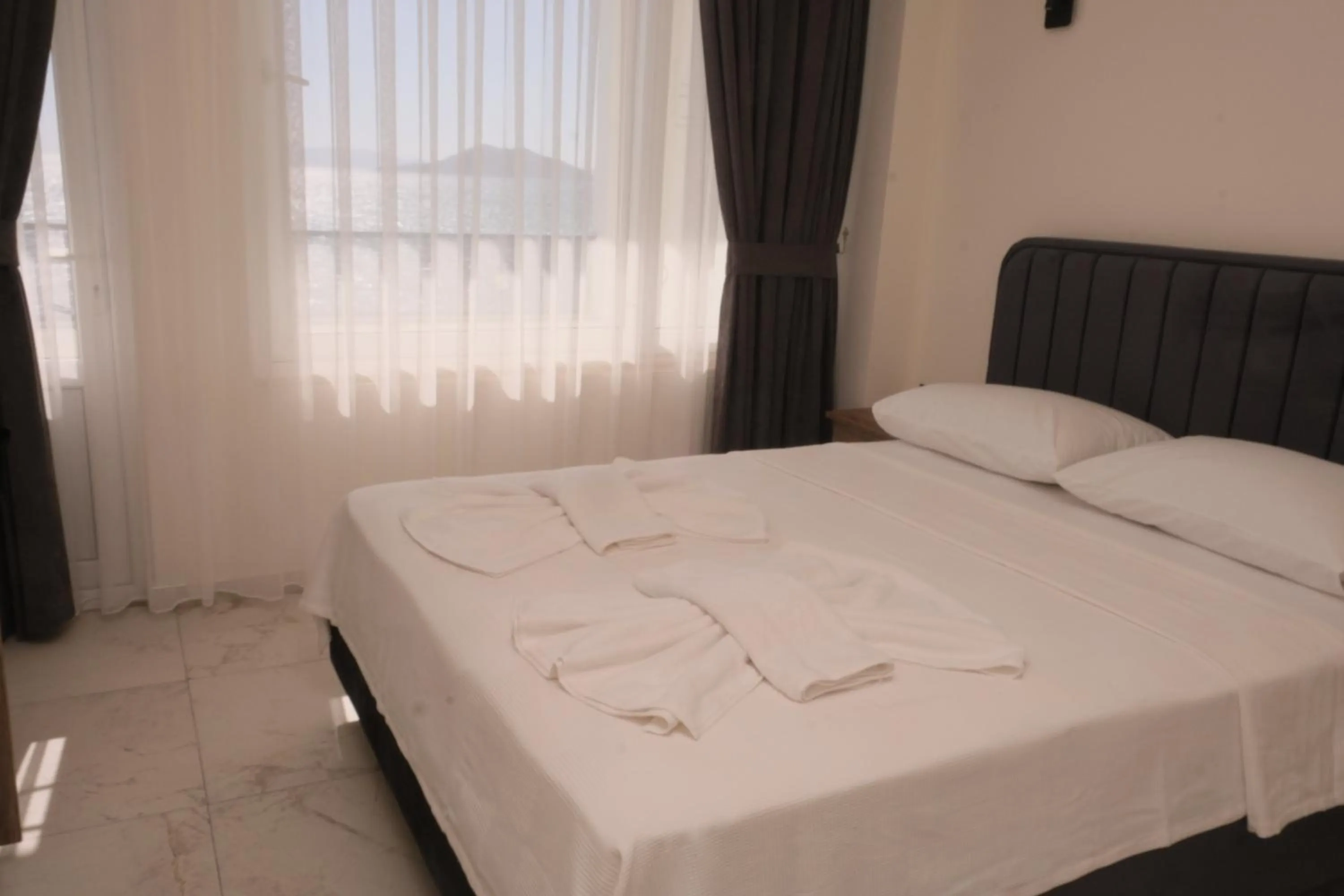 Bed in Sea Door Hotel