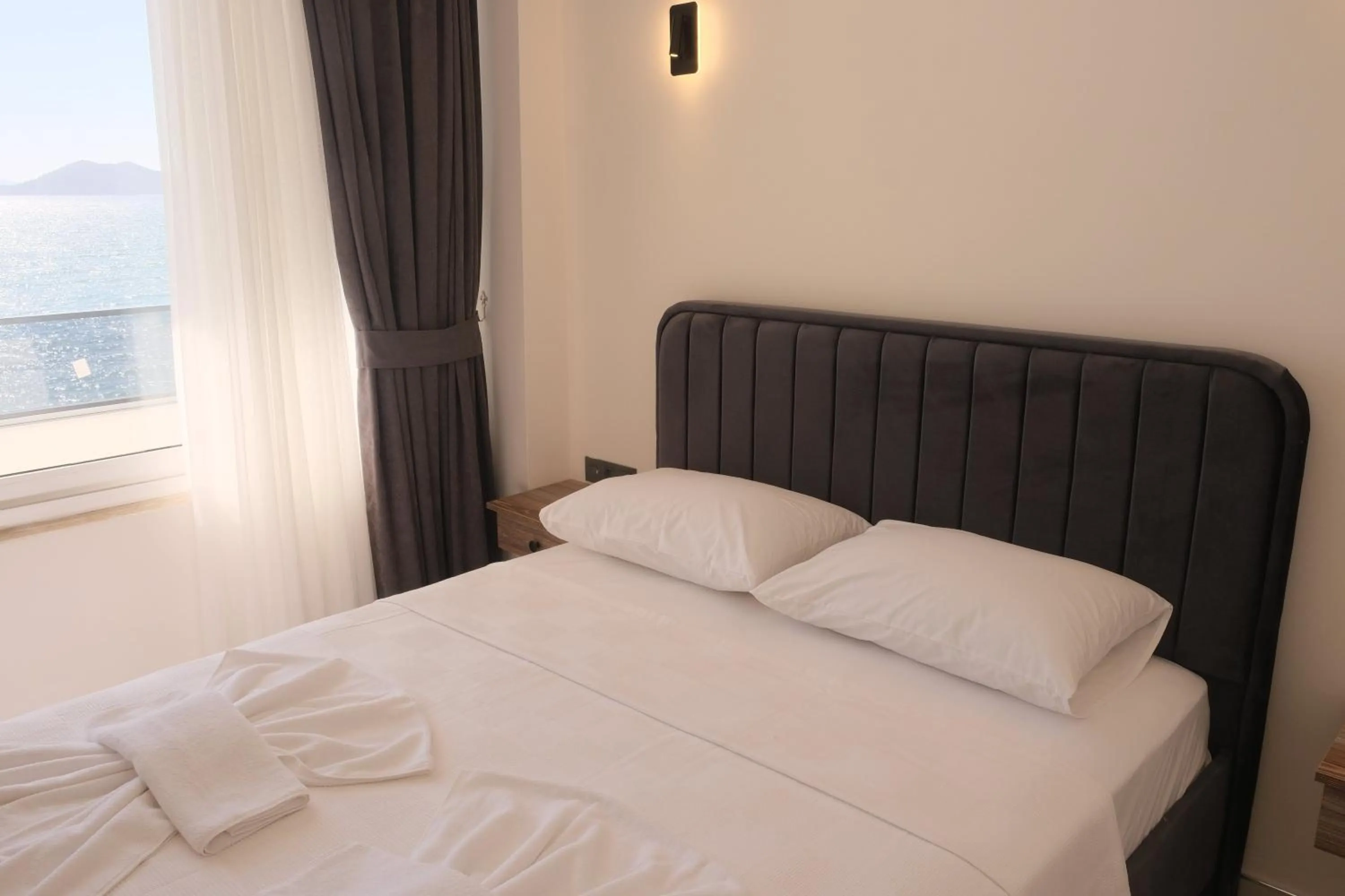 Bed in Sea Door Hotel