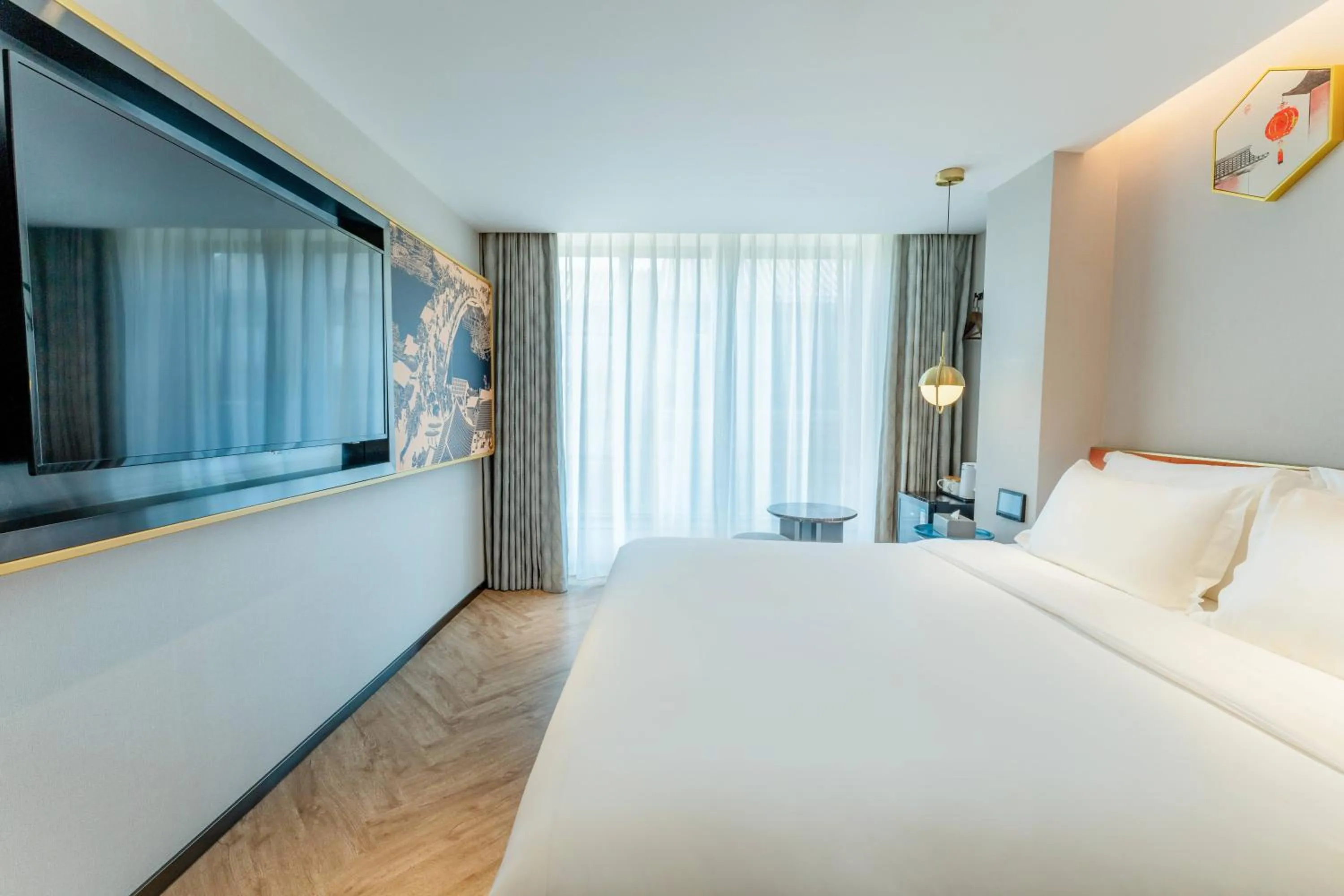 Bed in M Hotel - Beijing Tiananmen Square Qianmen Subway Station