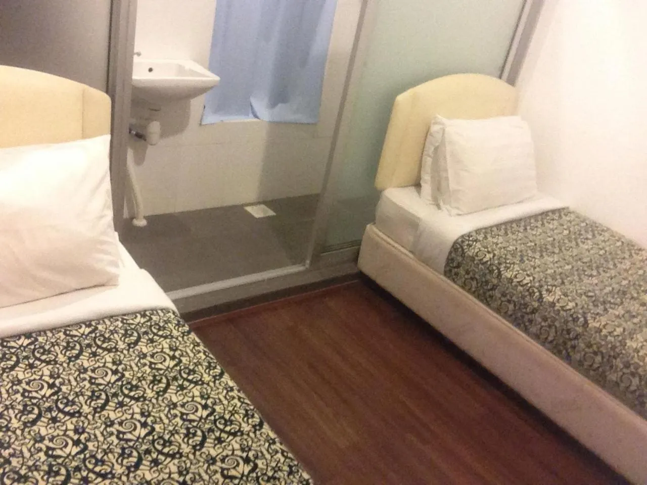 Photo of the whole room, Bed in Woodpecker Lodge, Kuching