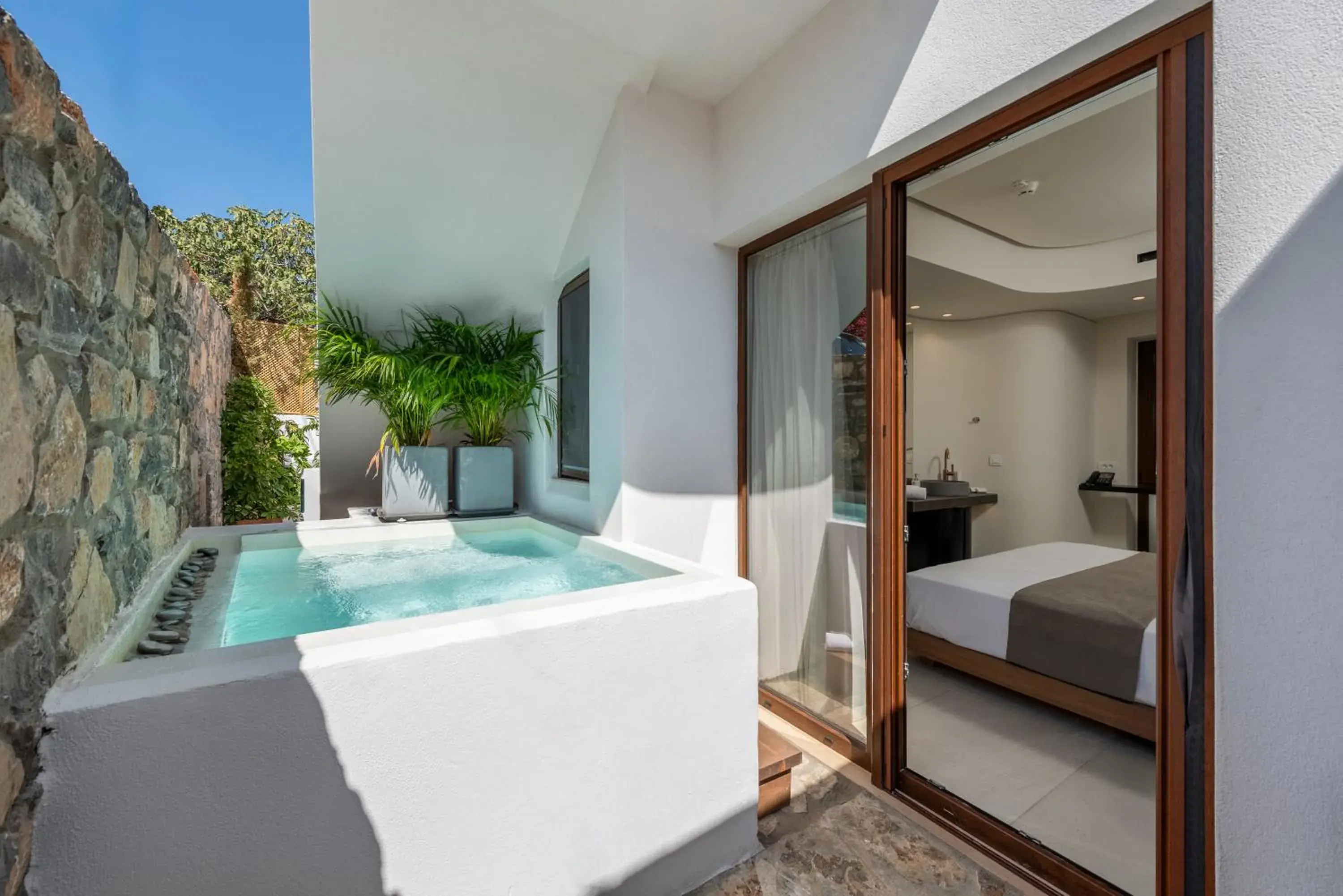 Junior Suite with Outdoor Jetted Tub in Elounda Stories Boutique Hotel Junior Suite with Outdoor Jetted Tub in Elounda Stories Boutique Hotel