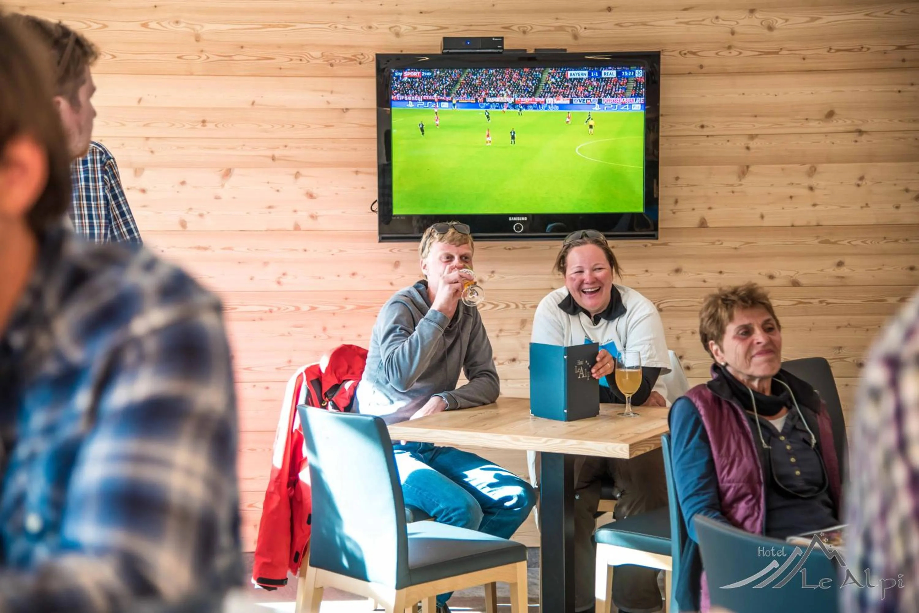Communal lounge/ TV room in Hotel Le Alpi