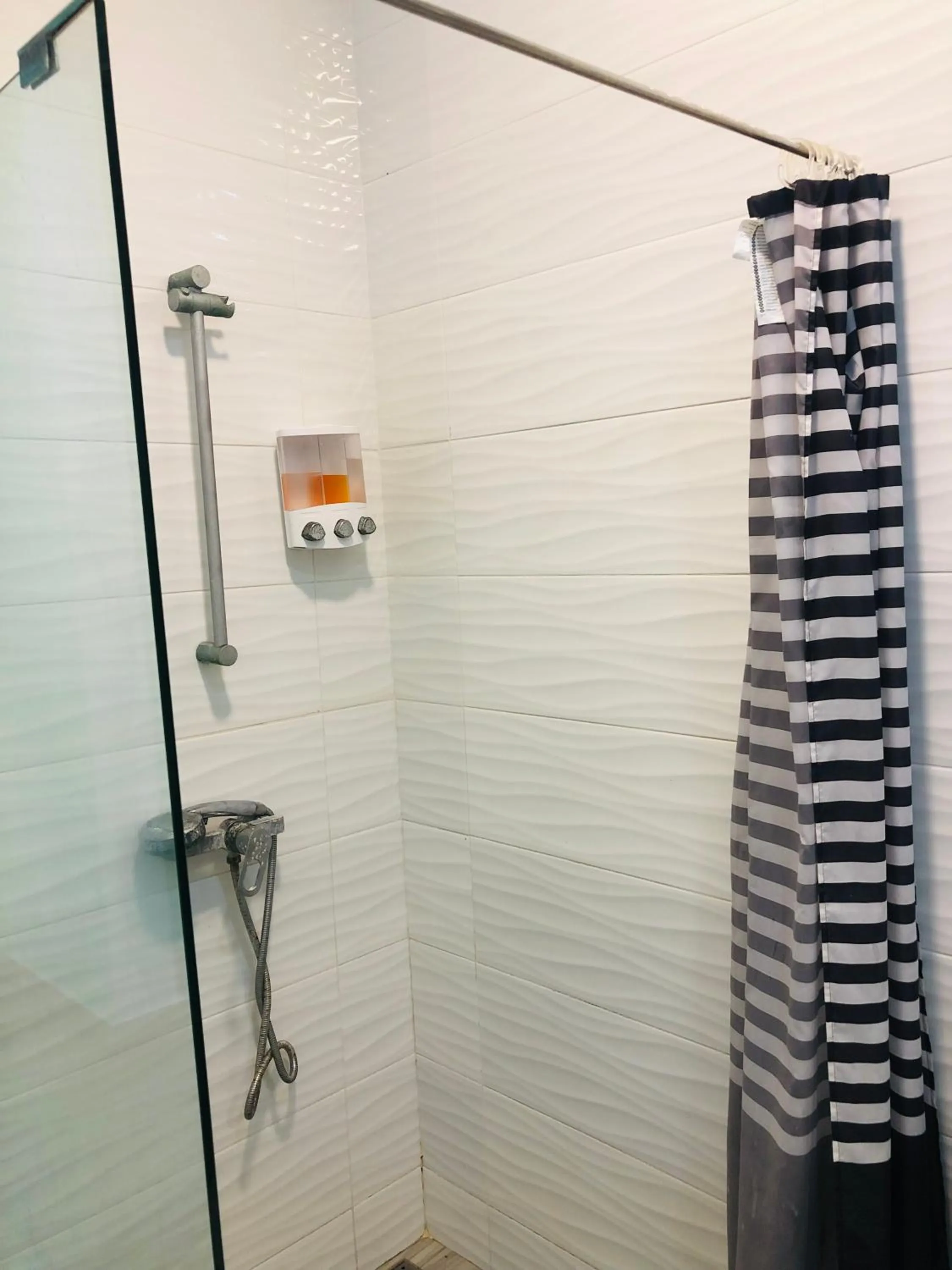 Bathroom in Ducassi Rooftop Pool Suites Beach Club and SPA