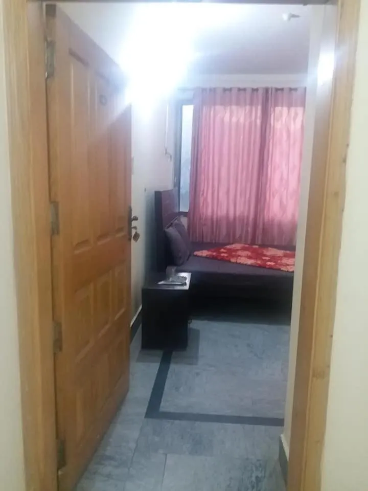 Bed in Kashmir Inn Hotel