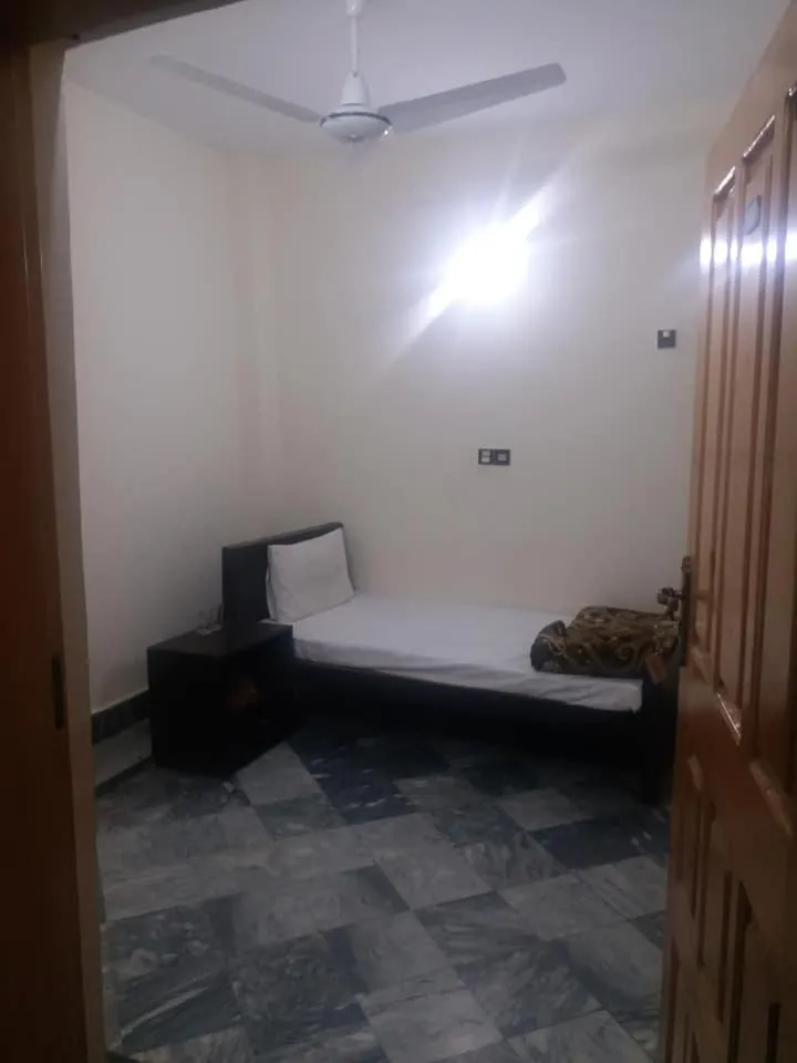 Bed in Kashmir Inn Hotel