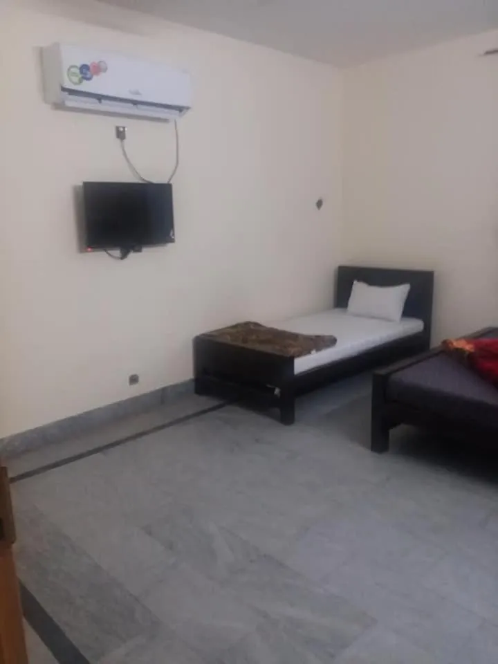 Bed in Kashmir Inn Hotel