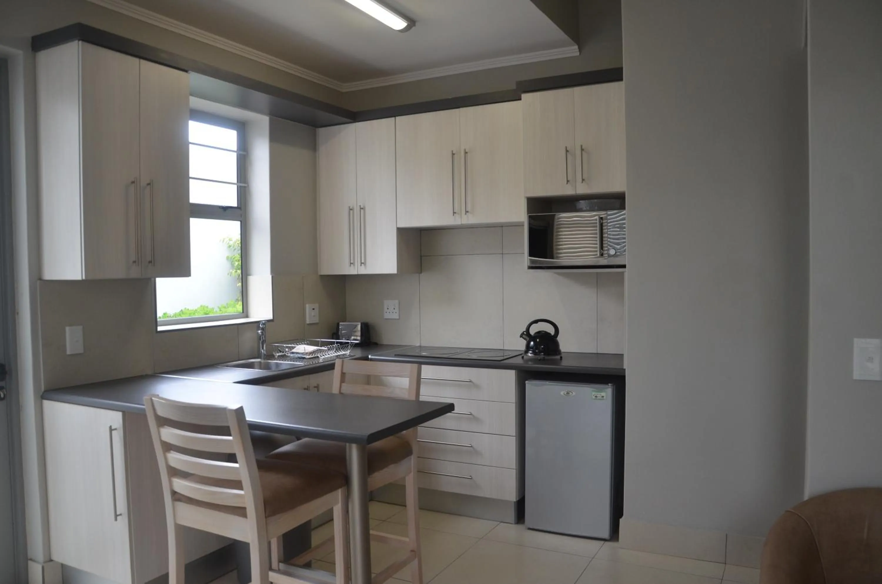 Kitchen or kitchenette in Be-Still Accommodation