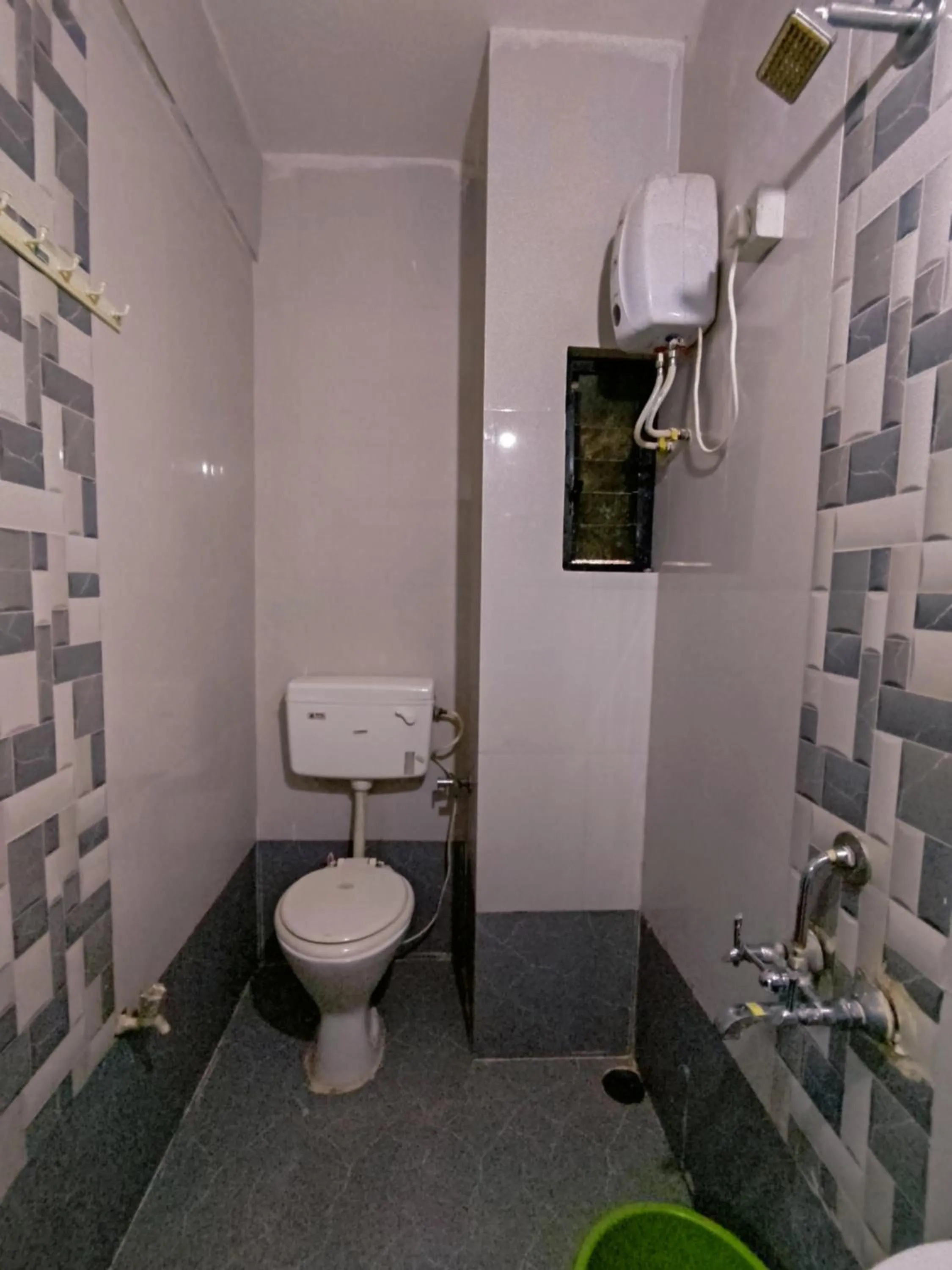 Shower in Ambient Homestay by NESTEASY