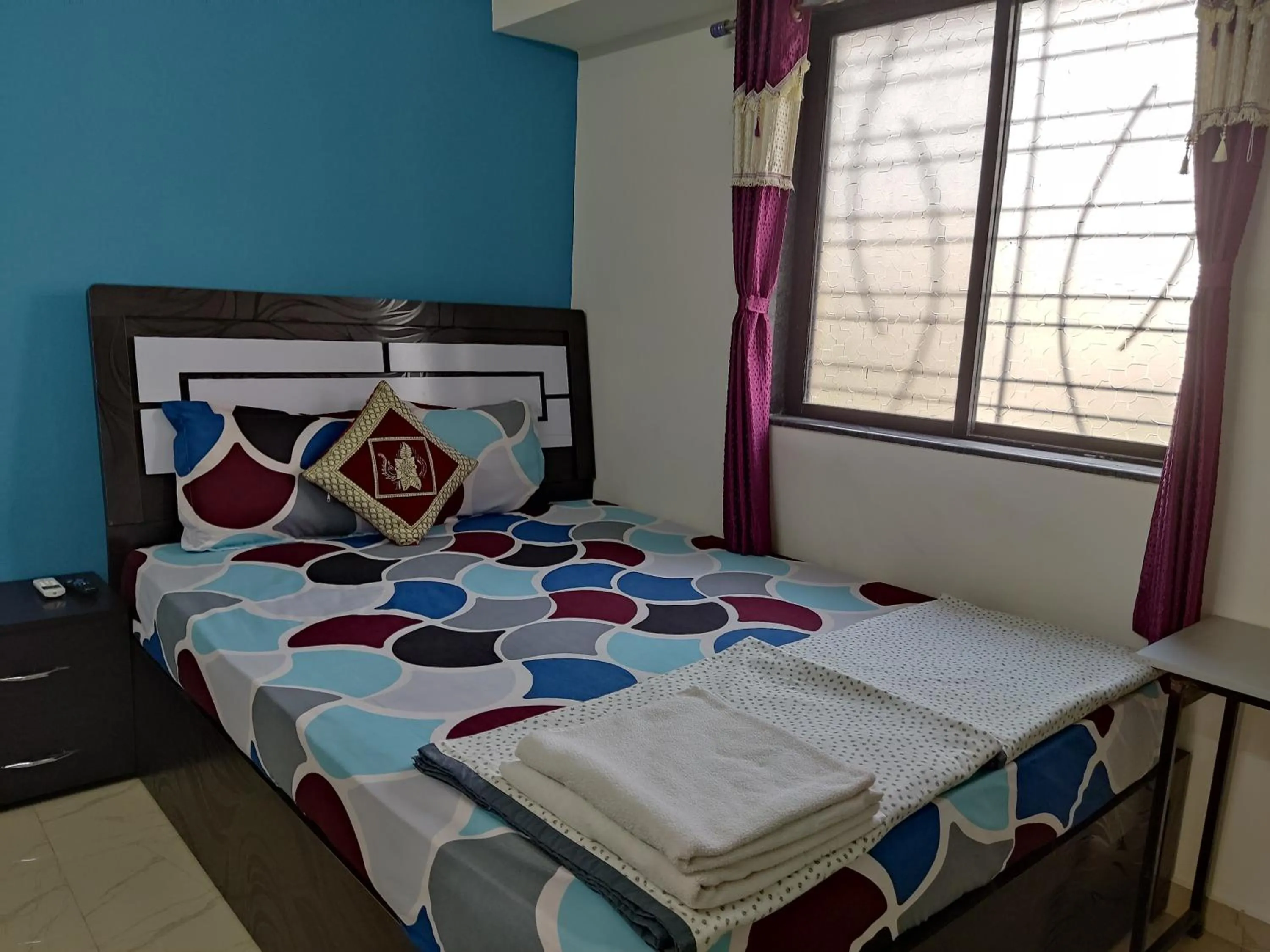 Bed in Ambient Homestay by NESTEASY