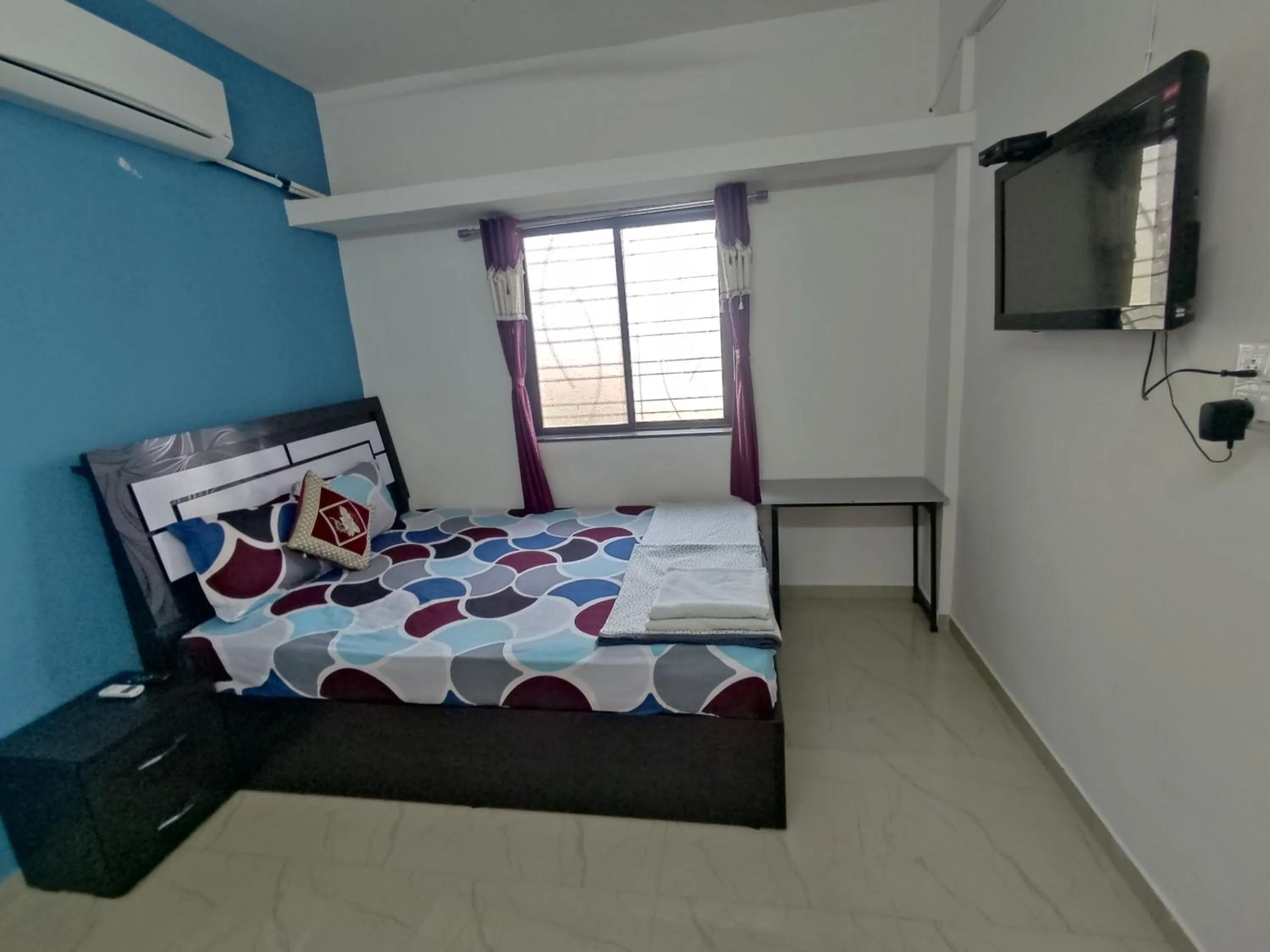 Bed in Ambient Homestay by NESTEASY