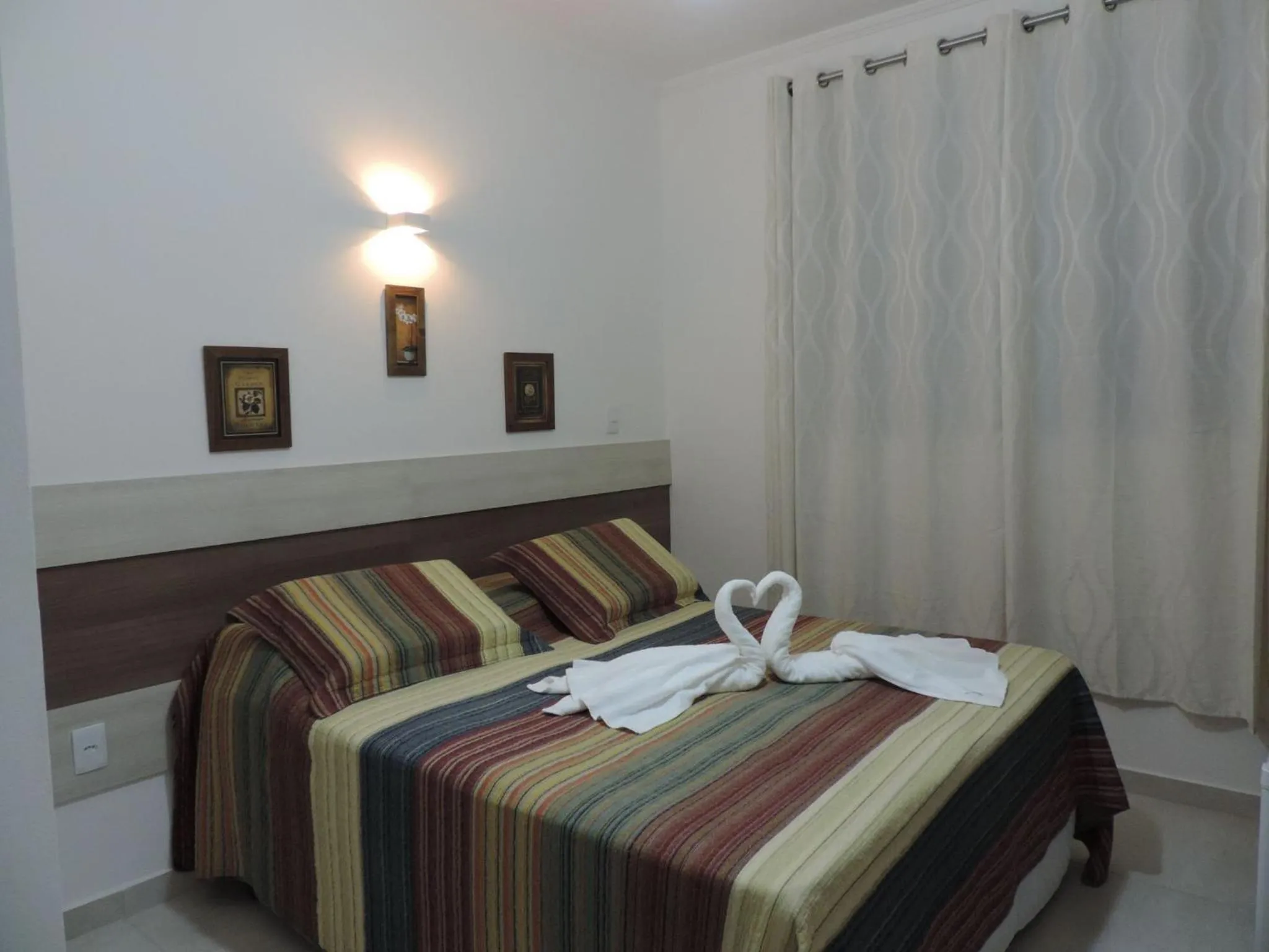 Bed in Pousada Recanto Jota Ge