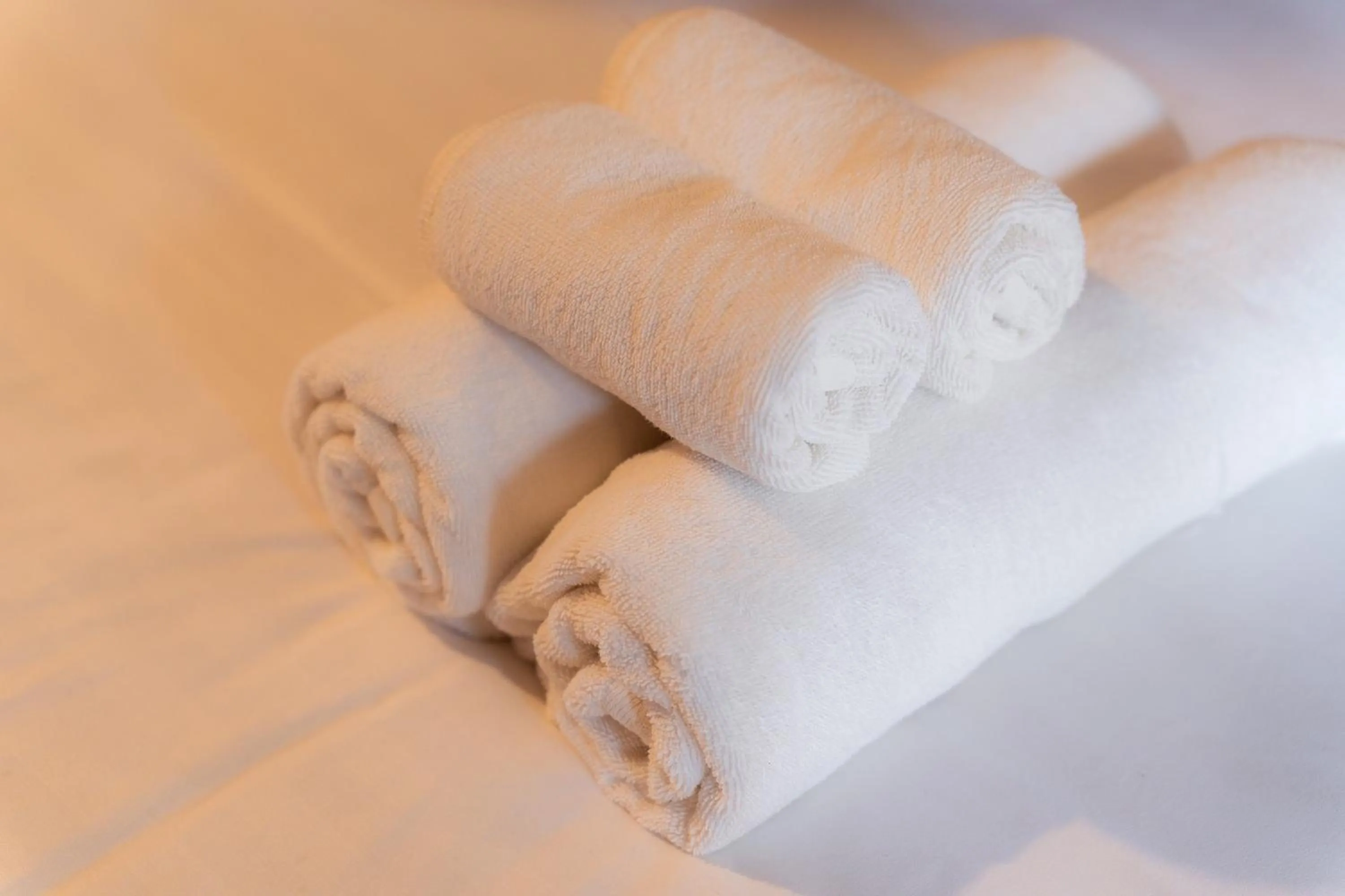 towels, Bed in Monruamsuk Homestay Cafe and Bistro