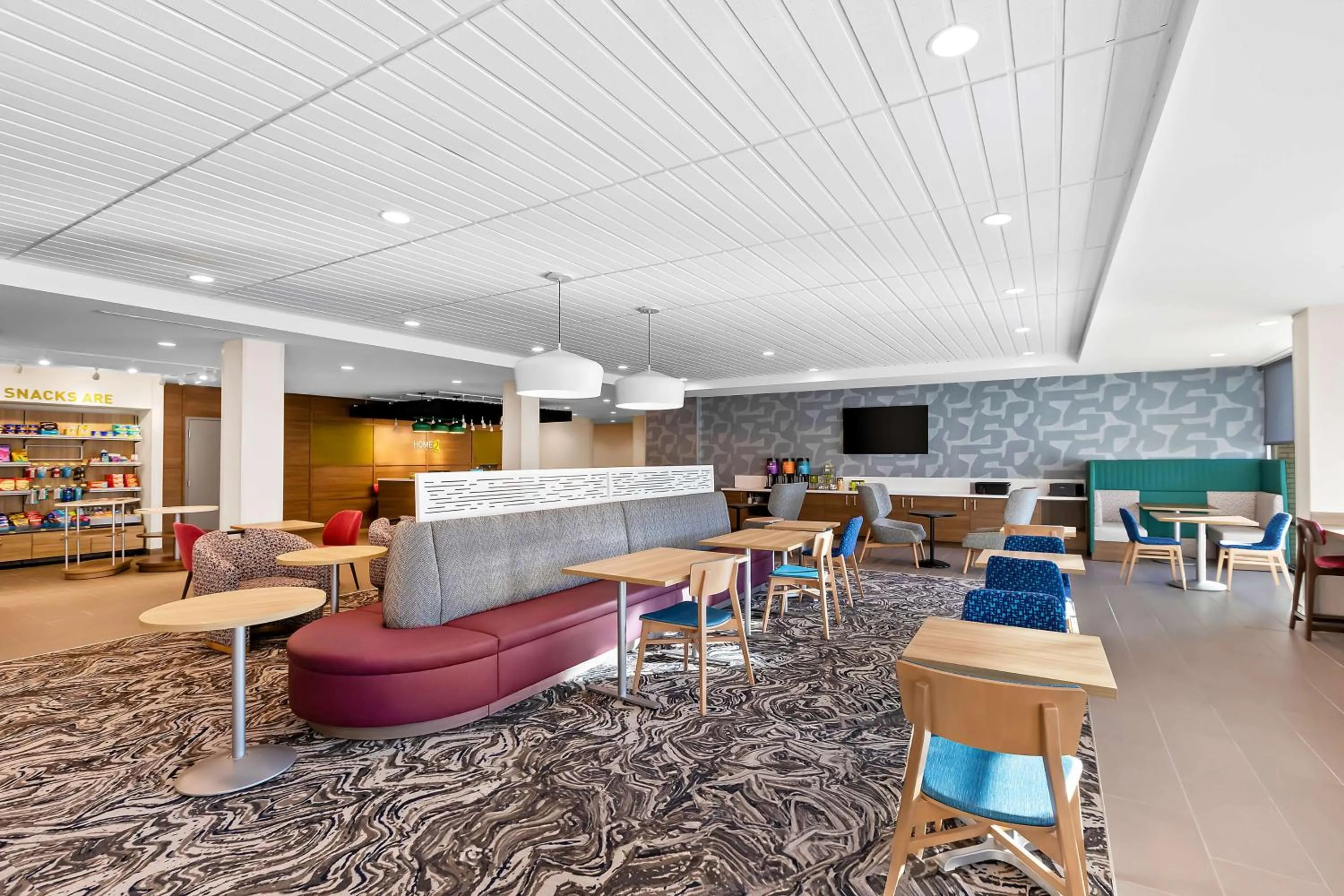 Communal lounge/ TV room in Home2 Suites By Hilton Hendersonville