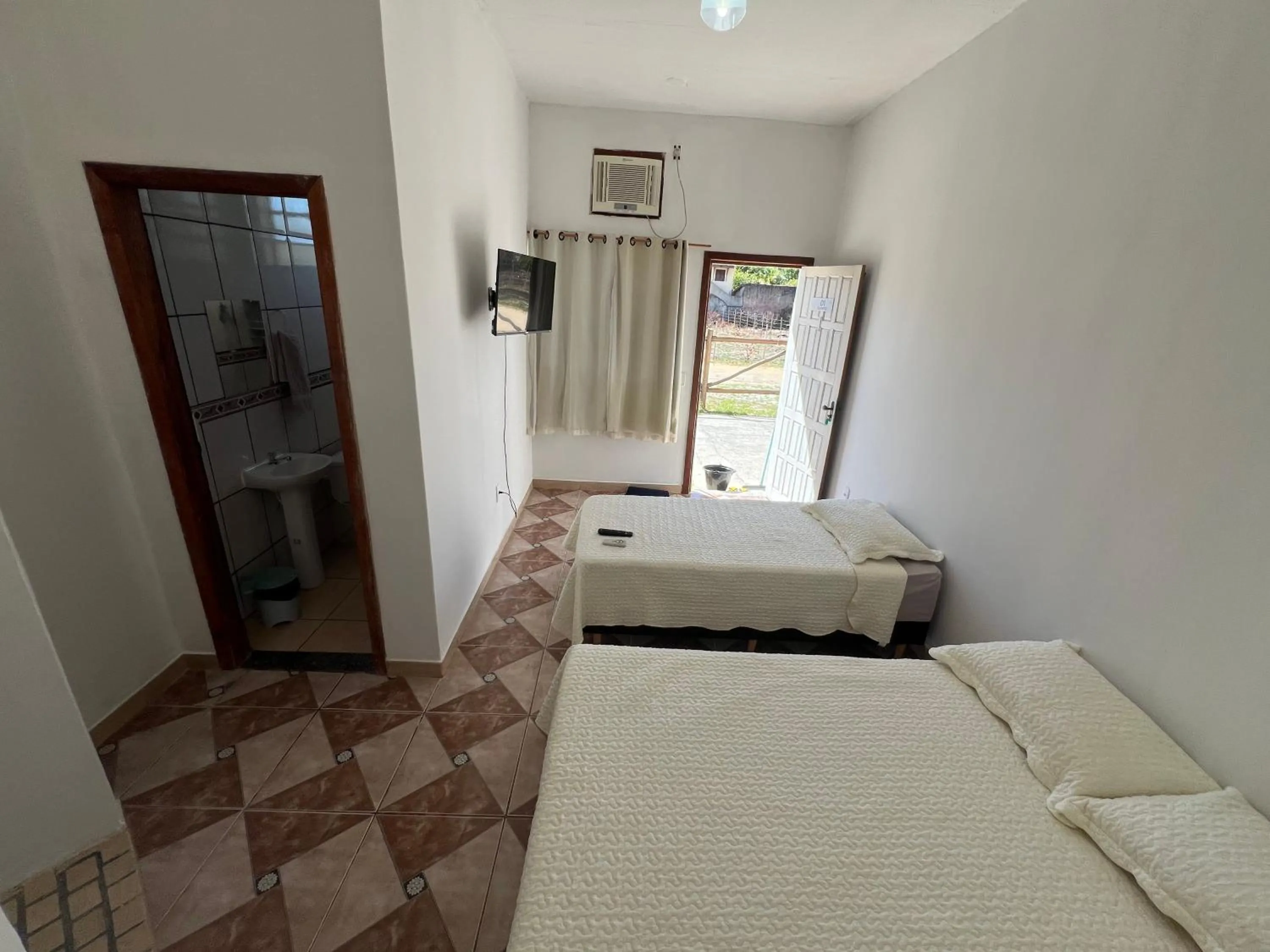 Bed in Pousada Recanto Vila Viçosa