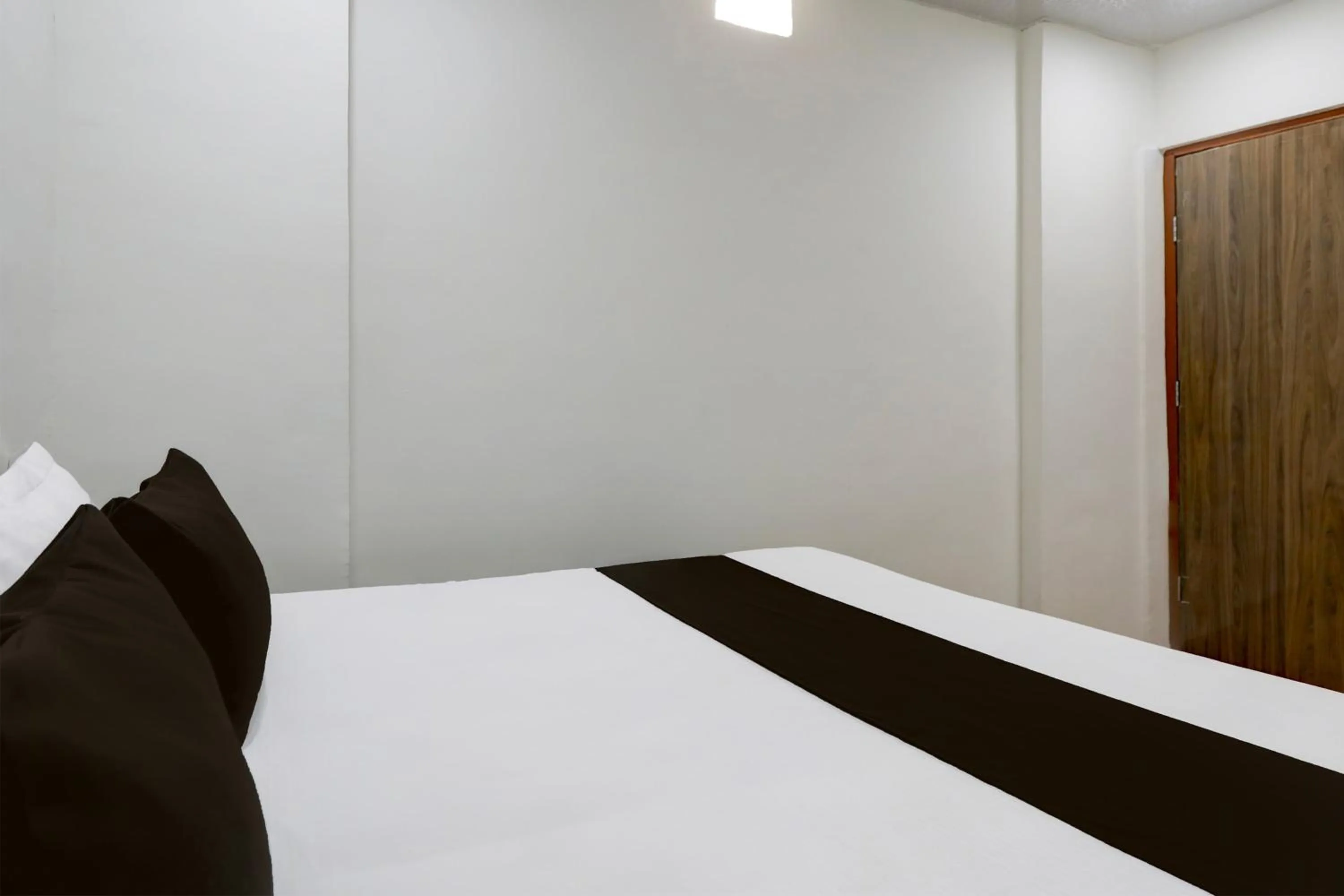 Bedroom in Hotel O Sky Villa