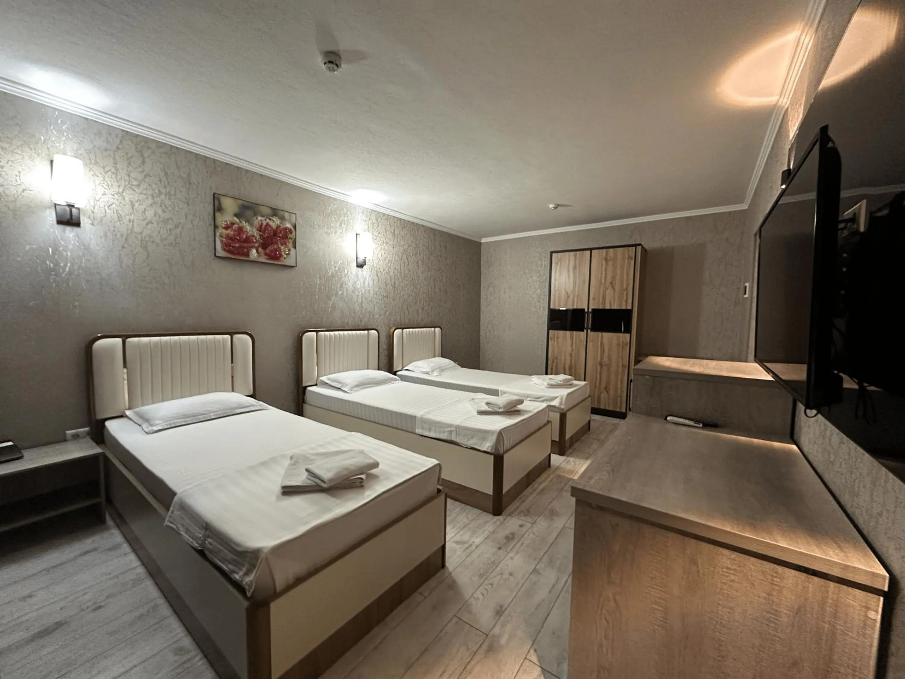 Bed in Artist Regency Hotel