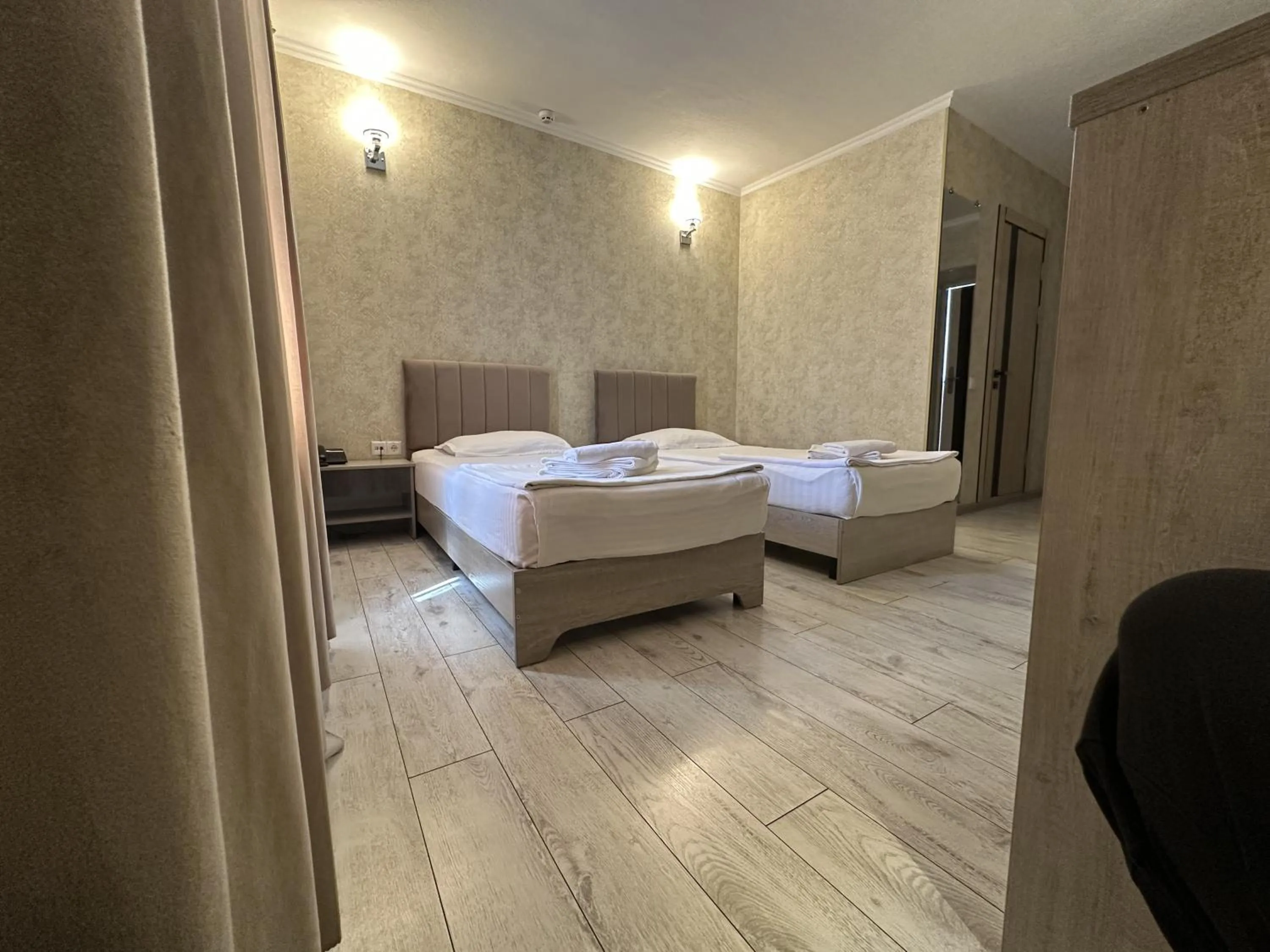 Bed in Artist Regency Hotel