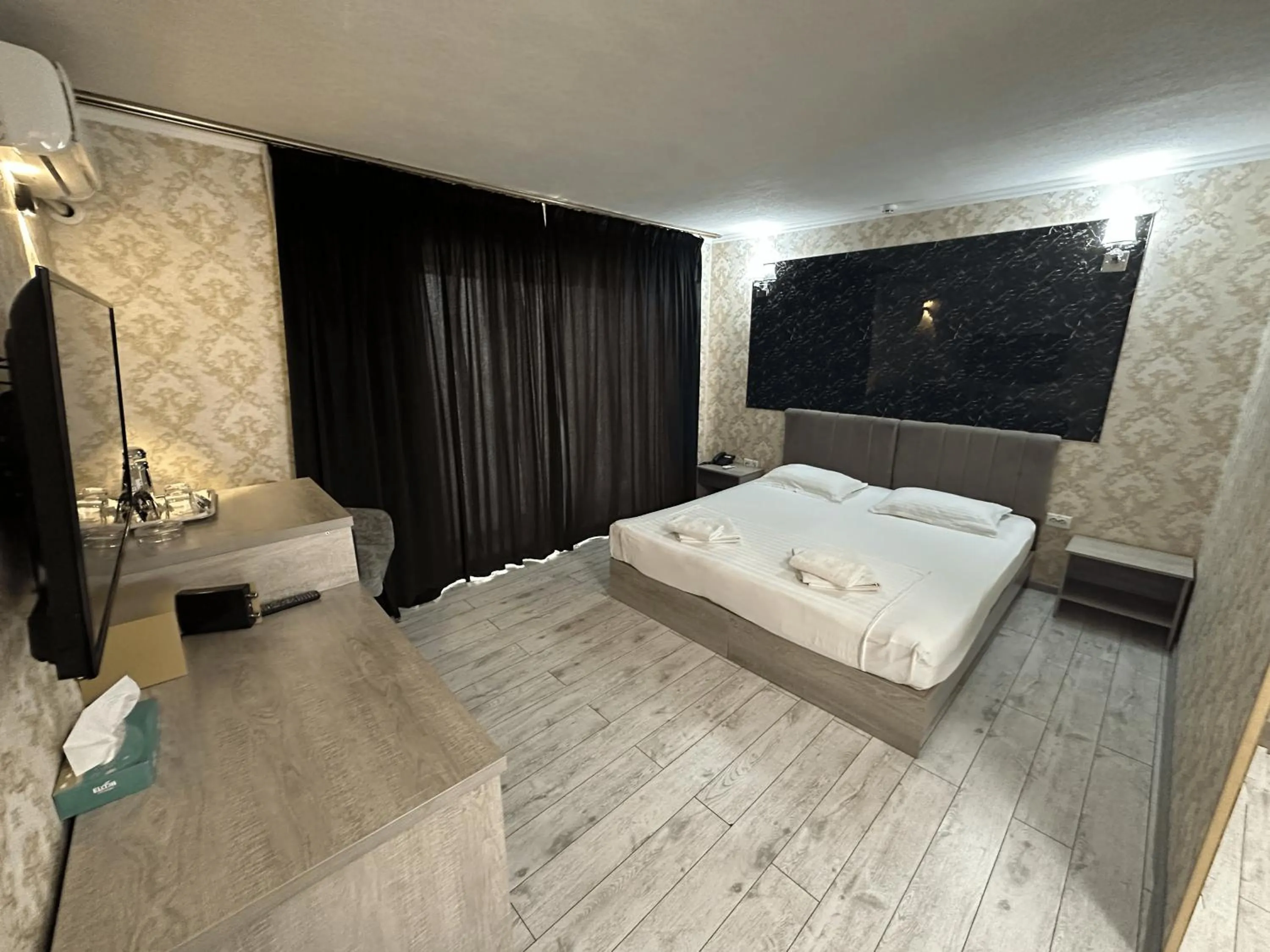 Bed in Artist Regency Hotel